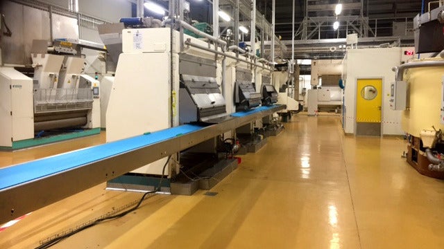 Troughed ThermoDrive conveyor belt on food-processing conveyor