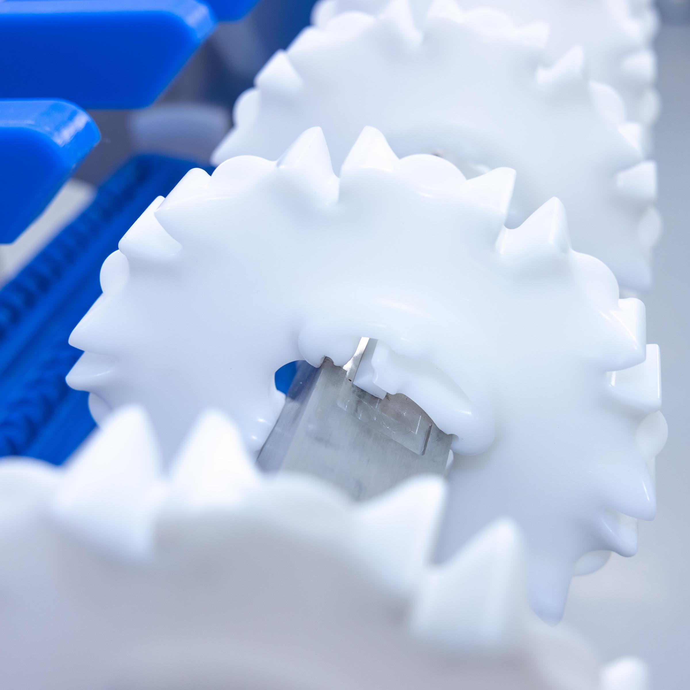 White CleanLock sprockets on CleanLock conveyor shaft