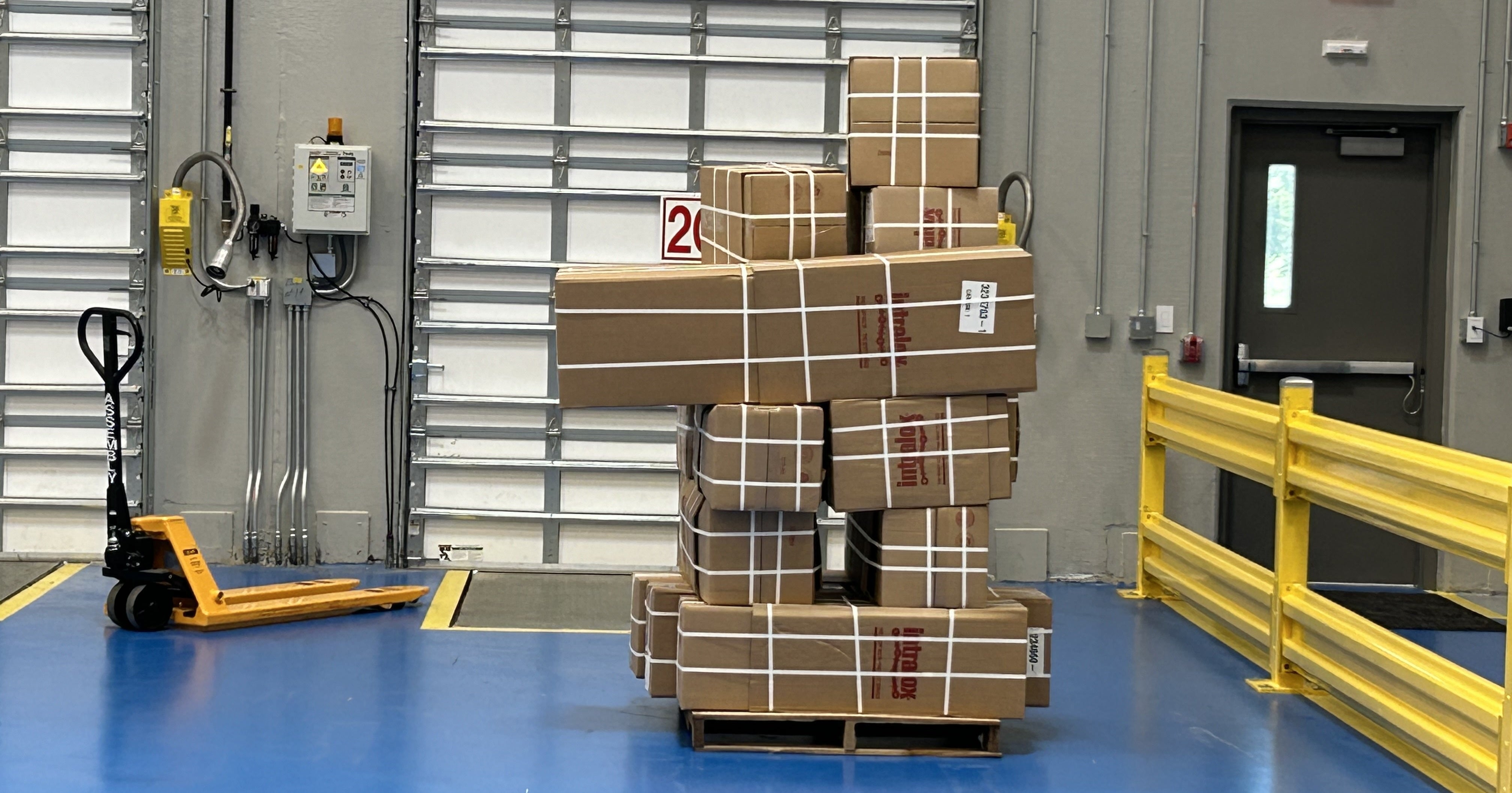 Stacked boxes ready to be shipped from a shipping bay at Intralox's warehouse