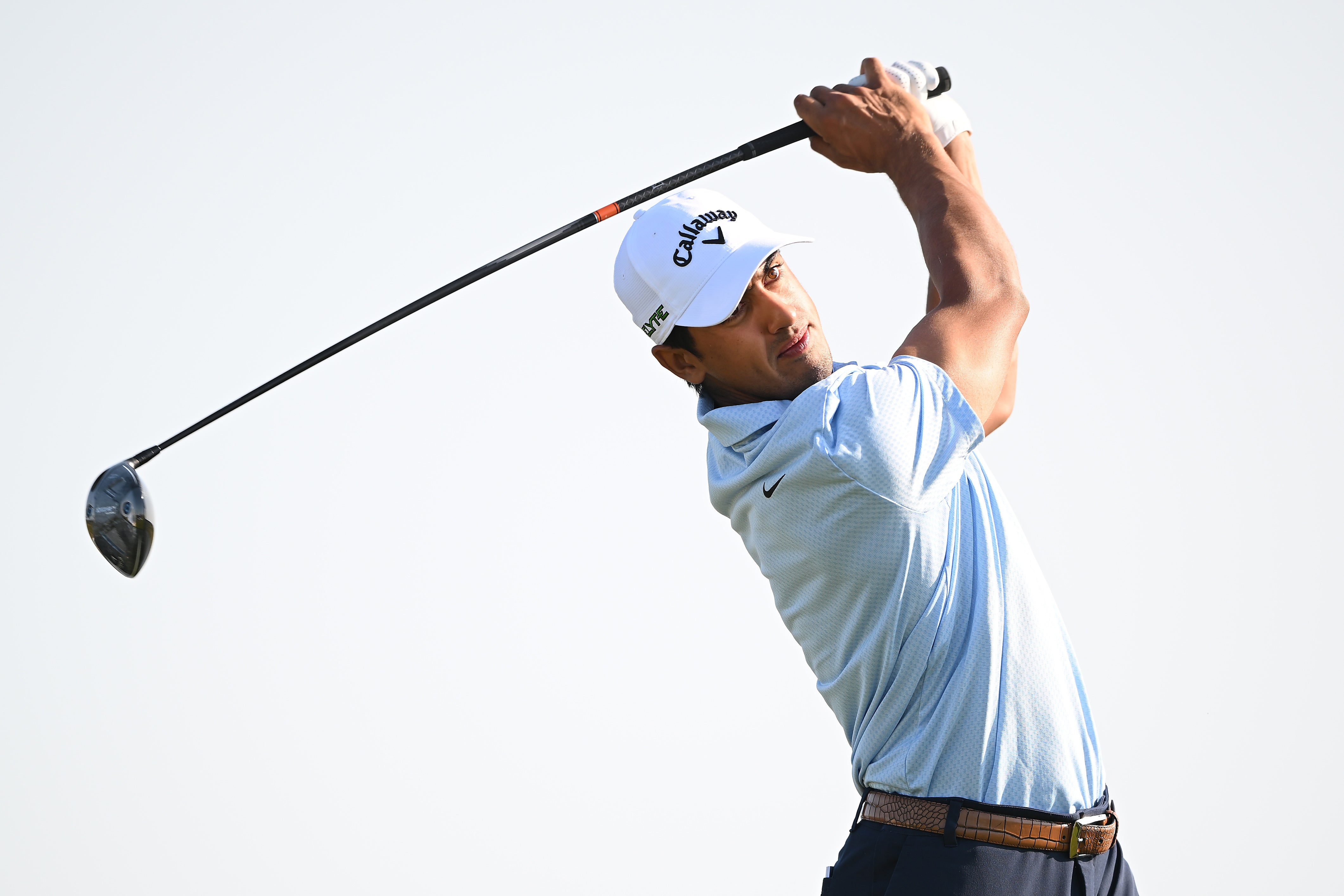 Sihan Sandhu swinging golf club.