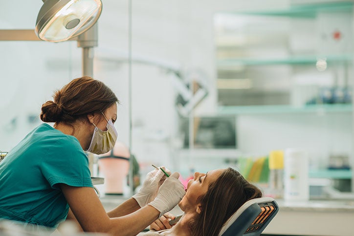 A woman getting treatment at a dental clinic