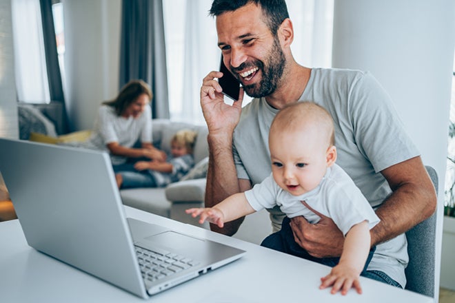 Review your private health insurance is important. Photo of man using a computer to review his private health cover