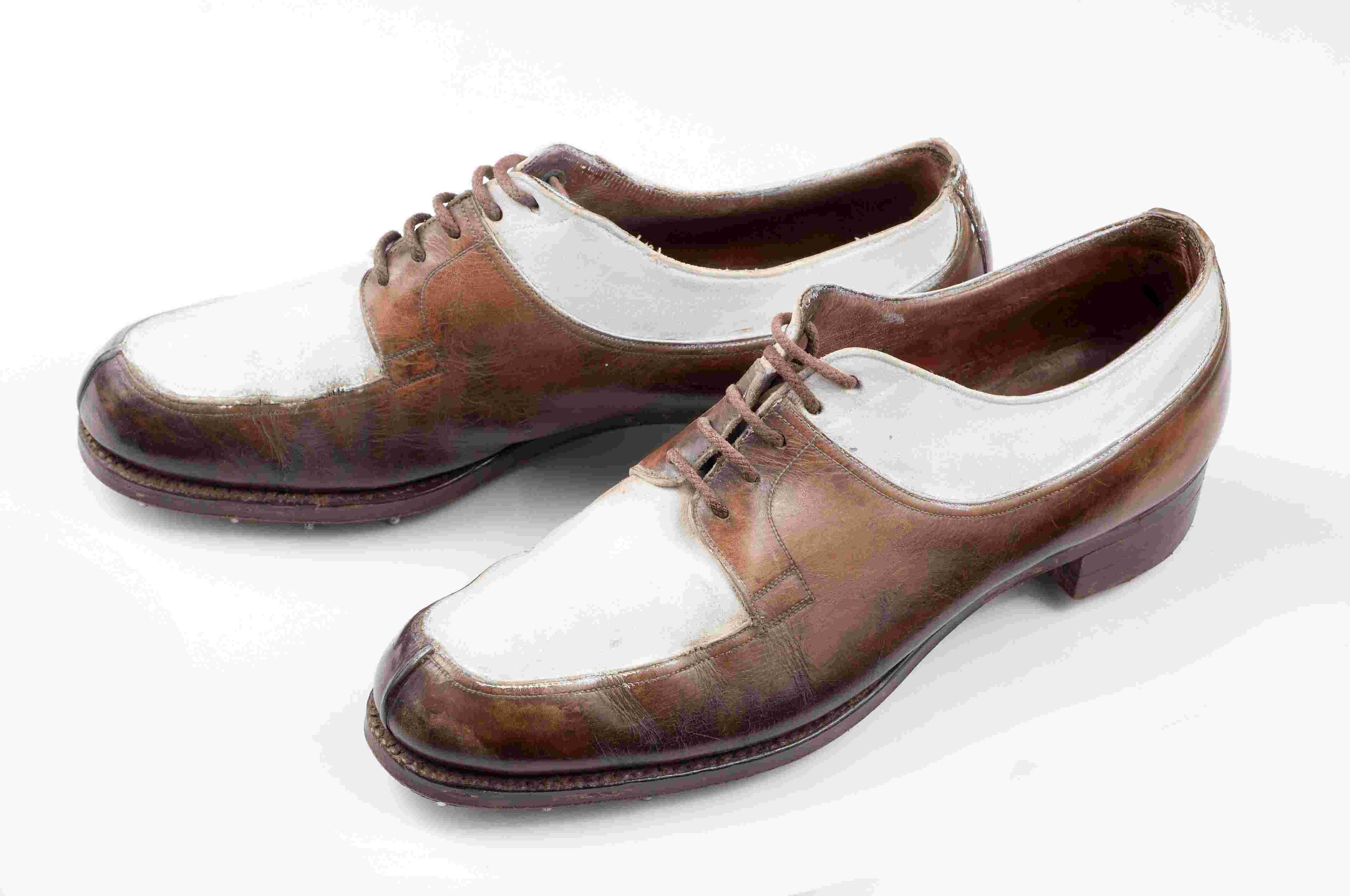 Cream and brown leather ladies golf shoes with slight heel.