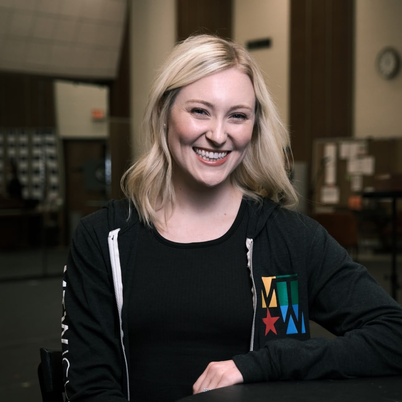 Blonde woman from Music Theatre of Wichita smiling at the camera