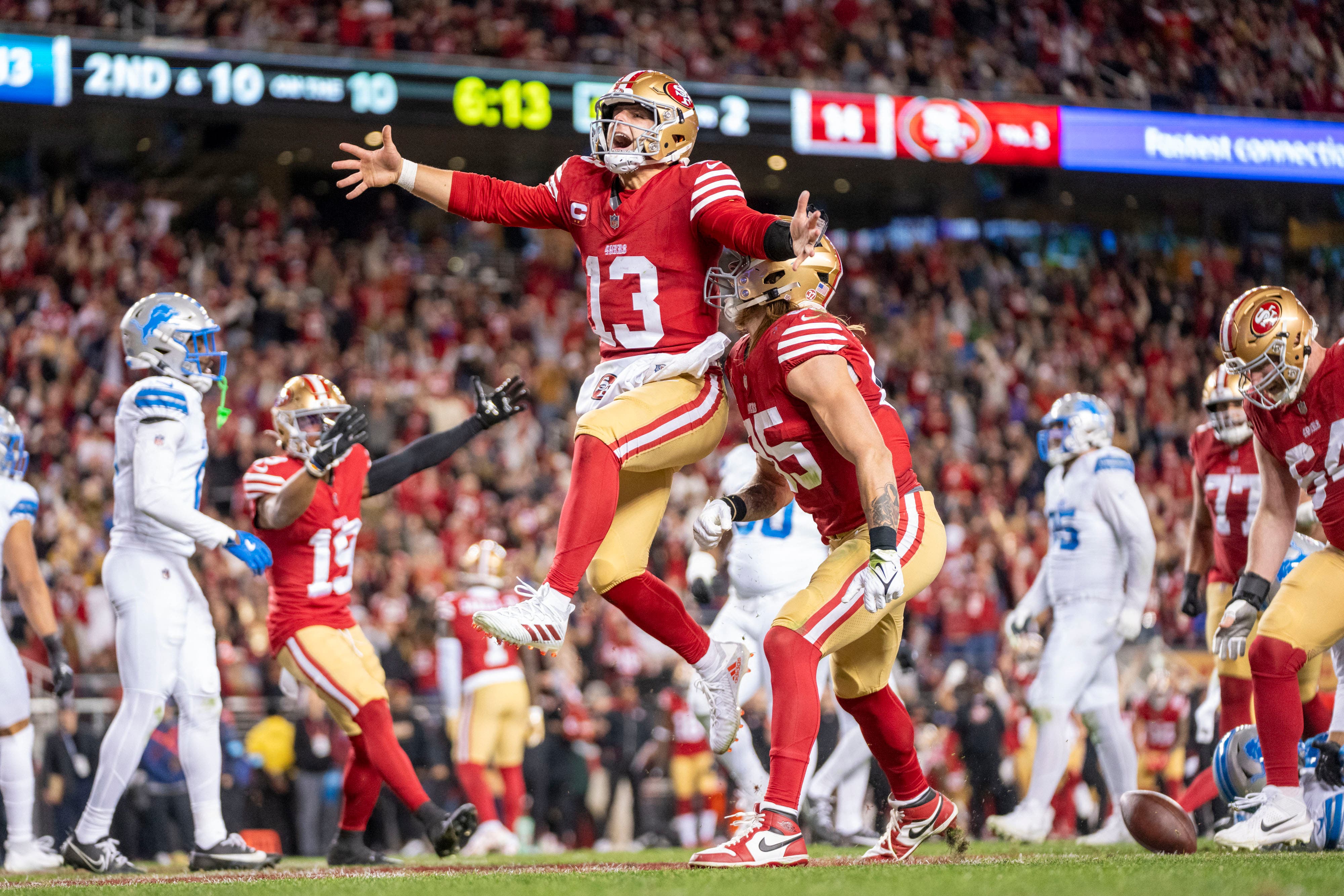 Brock Purdy from the San Francisco 49ers celebrating a touchdown against the Detroit Lions.