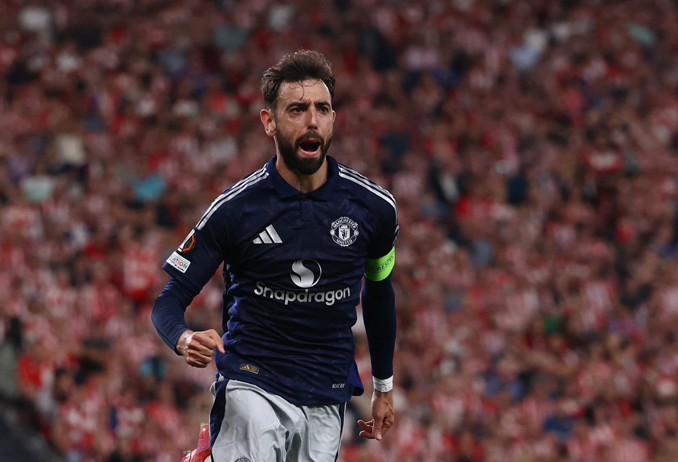 Manchester United's Bruno Fernandes celebrates scoring their third goal 