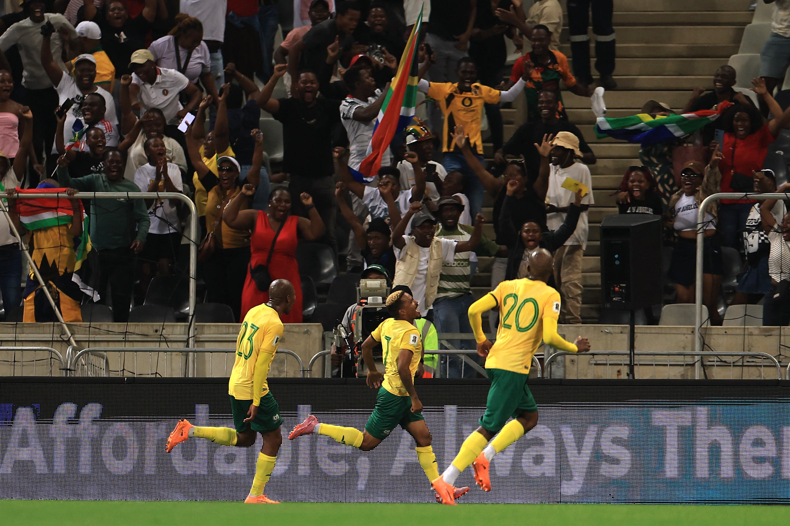 Soccer Football - FIFA World Cup - CAF Qualifiers - Group C - South Africa v Rwanda - Mbombela Stadium, Mbombela, South Africa - October 14, 2025 South Africa's Oswin Appollis celebrates scoring their second goal with teammates REUTERS/Esa Alexander