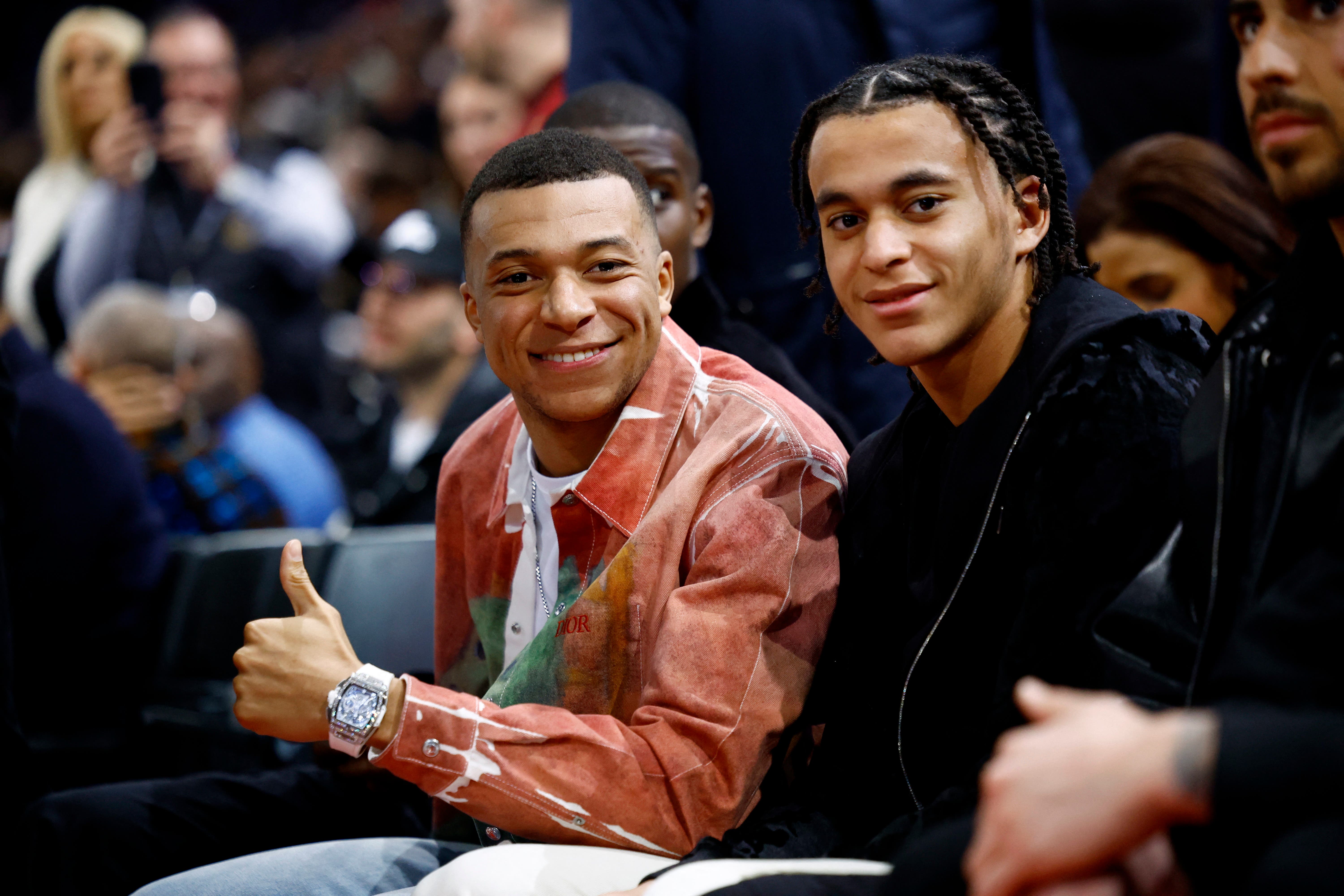 Basketball - NBA Paris Game 2024 - Brooklyn Nets v Cleveland Cavaliers - Accor Arena, Paris, France - January 11, 2024 Footballers Paris St Germain's Kylian Mbappe with his brother Ethan Mbappe before the game REUTERS/Sarah Meyssonnier