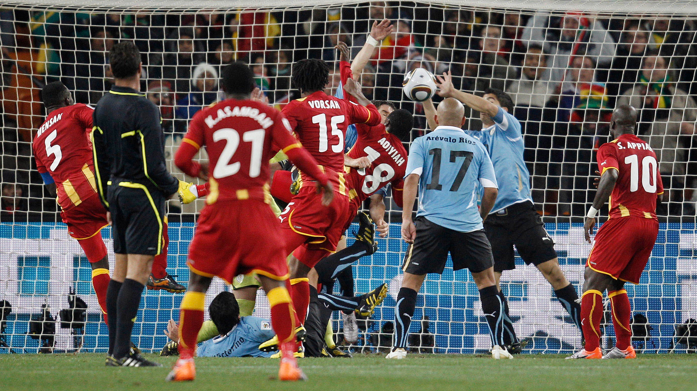 Football - Uruguay v Ghana FIFA World Cup Quarter Final - South Africa 2010 - Soccer City Stadium, Johannesburg, South Africa - 2/7/10 Uruguay's Luis Suarez (2nd R) handles the ball on the goal line and is subsequently shown a red card by referee Olegario Benquerenca (2nd L) Mandatory Credit: Action Images / Carl Recine Livepic

