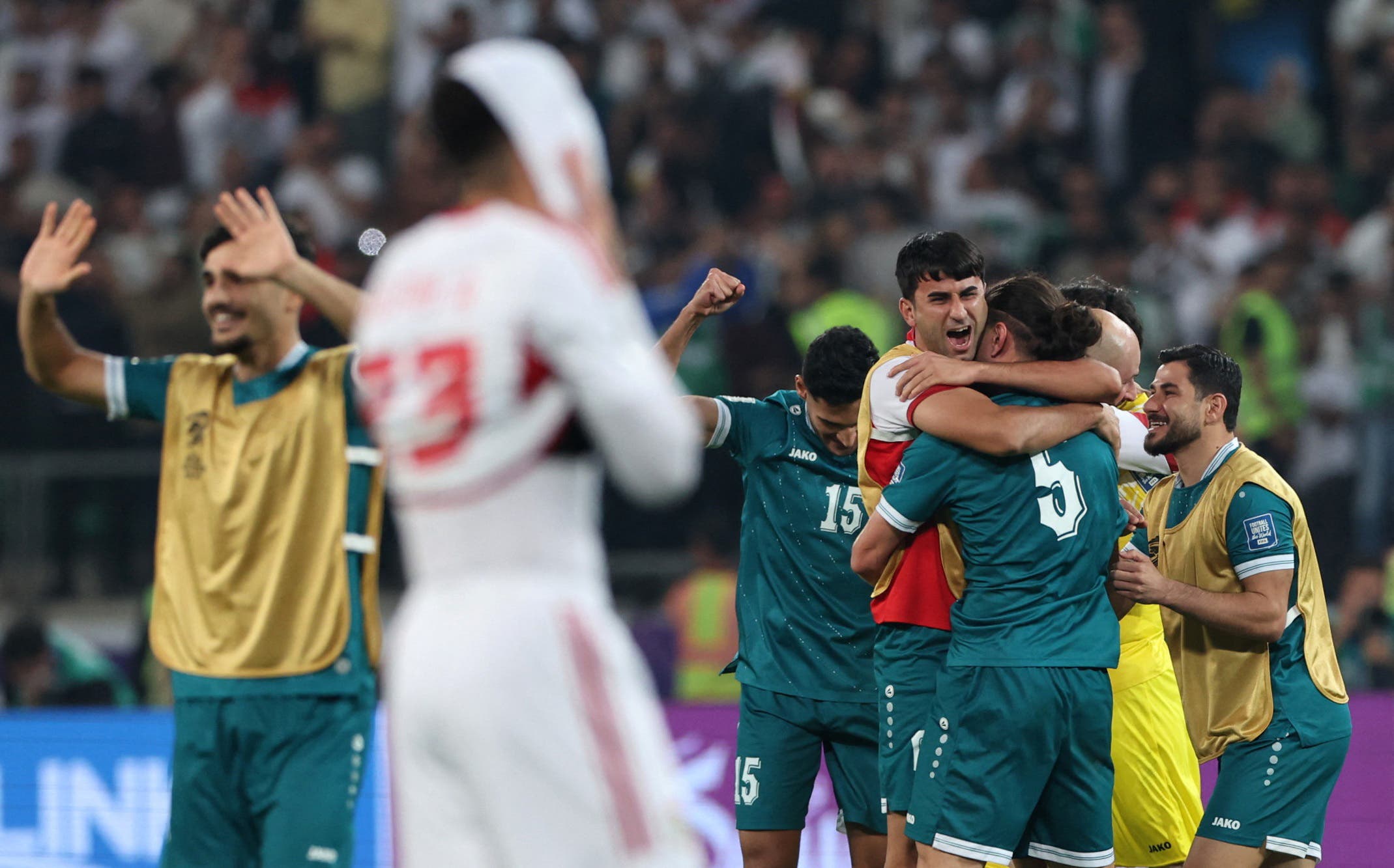 Soccer Football - FIFA World Cup - AFC Qualifiers - Play Off - Second Leg - Iraq v United Arab Emirates - Basra International Stadium, Basra, Iraq - November 18, 2025 Iraq's Manaf Younis celebrates with teammates after the match REUTERS/Thaier Al-Sudani