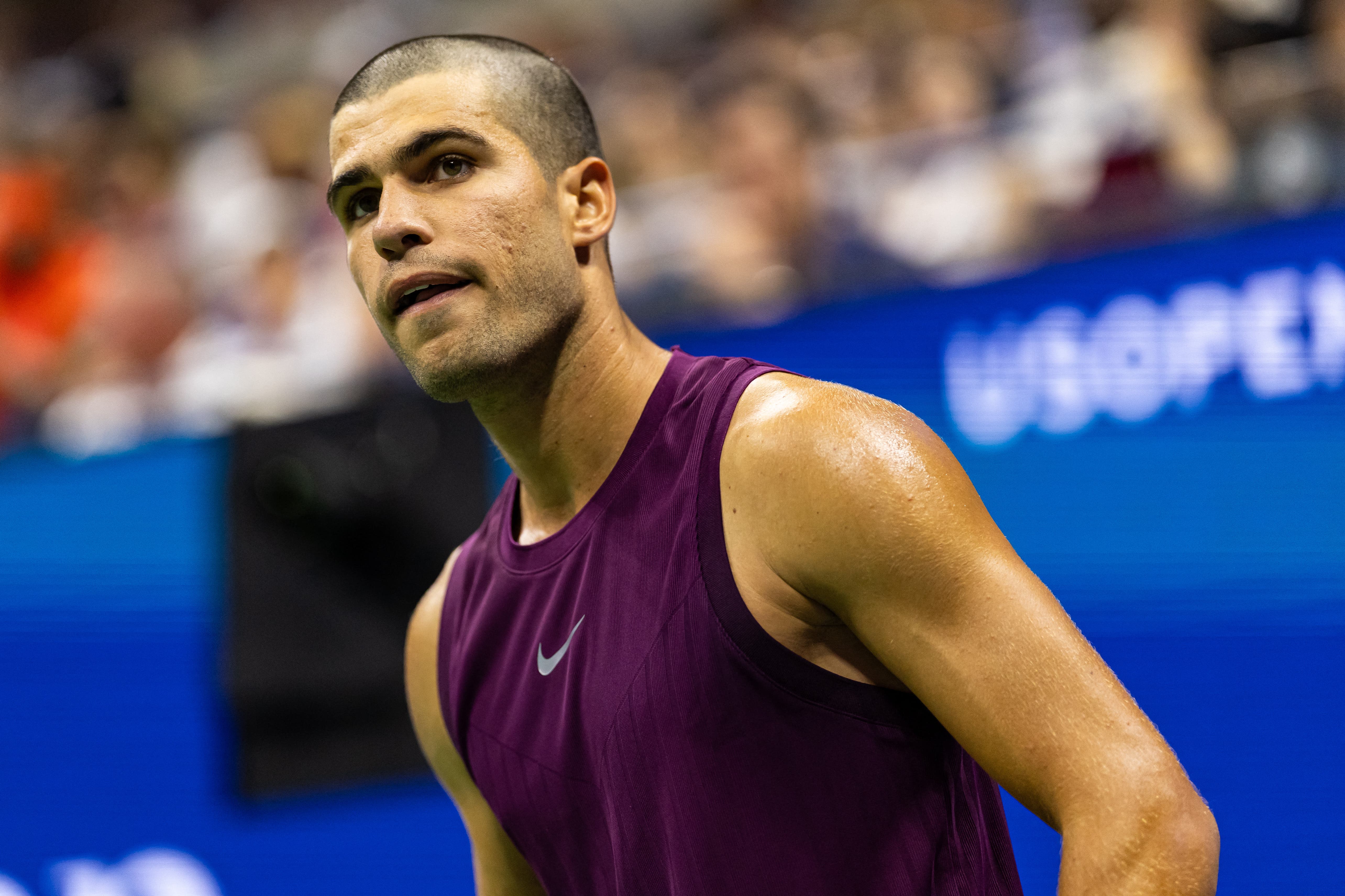 Aug 25, 2025; Flushing, NY, USA; Carlos Alcaraz of Spain in action against Reilly Opelka of the United States in the first round of the men’s singles at the US Open at Arthur Ashe Stadium in Billie Jean King National Tennis Centre. Mandatory Credit: Mike Frey-Imagn Images