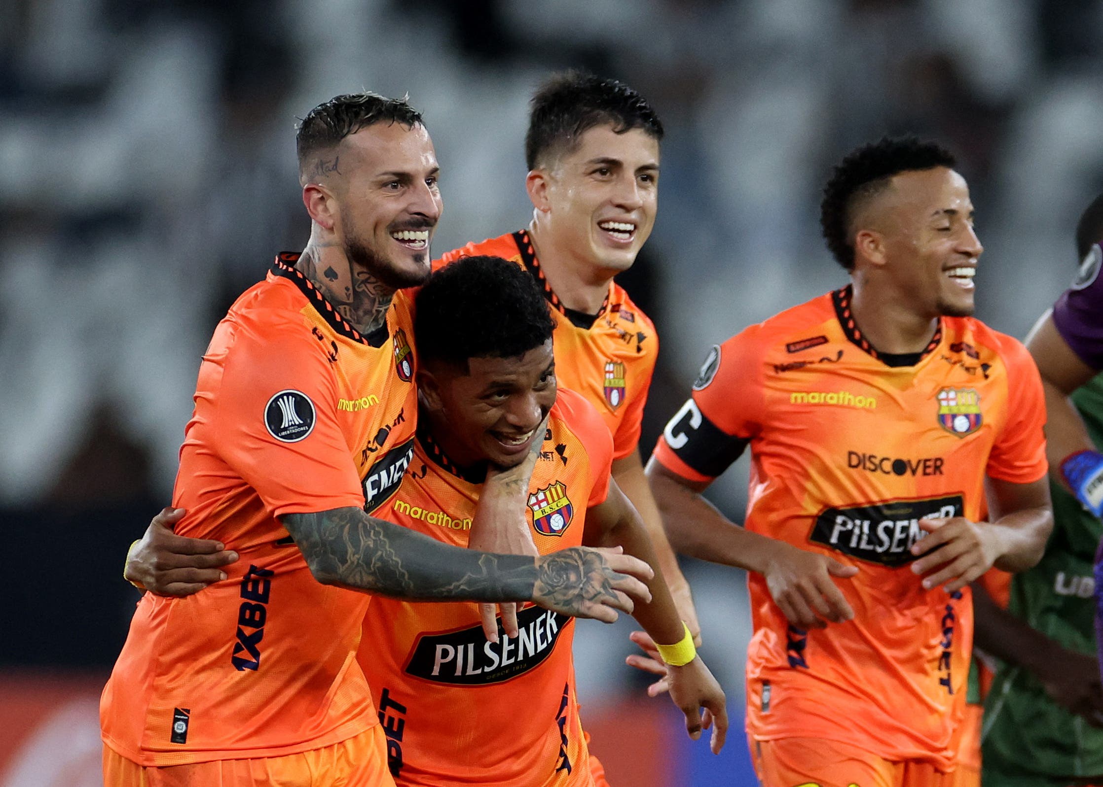 Soccer Football - Copa Libertadores - Third Qualifying Round - Second Leg - Botafogo v Barcelona SC - Estadio Nilton Santos, Rio de Janeiro, Brazil - March 10, 2026 Barcelona SC's Dario Benedetto, Jonathan Perlaza, Lucas Sosa and Byron Castillo celebrate after the match REUTERS/Pilar Olivares
