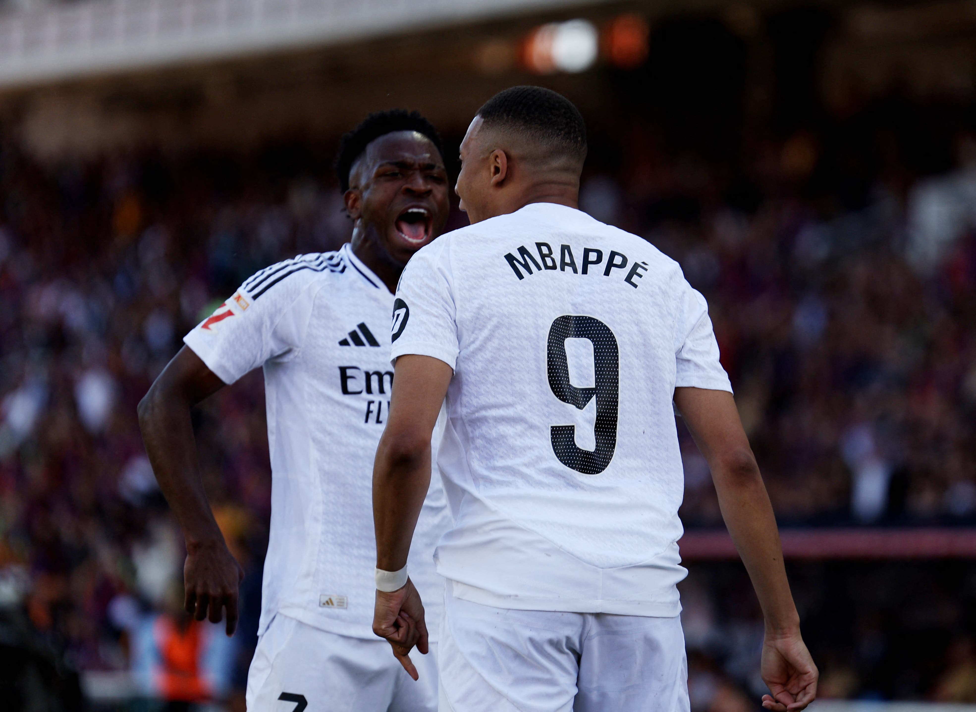 Vinícius Jr. and Kylian Mbappé celebrating for Real Madrid.