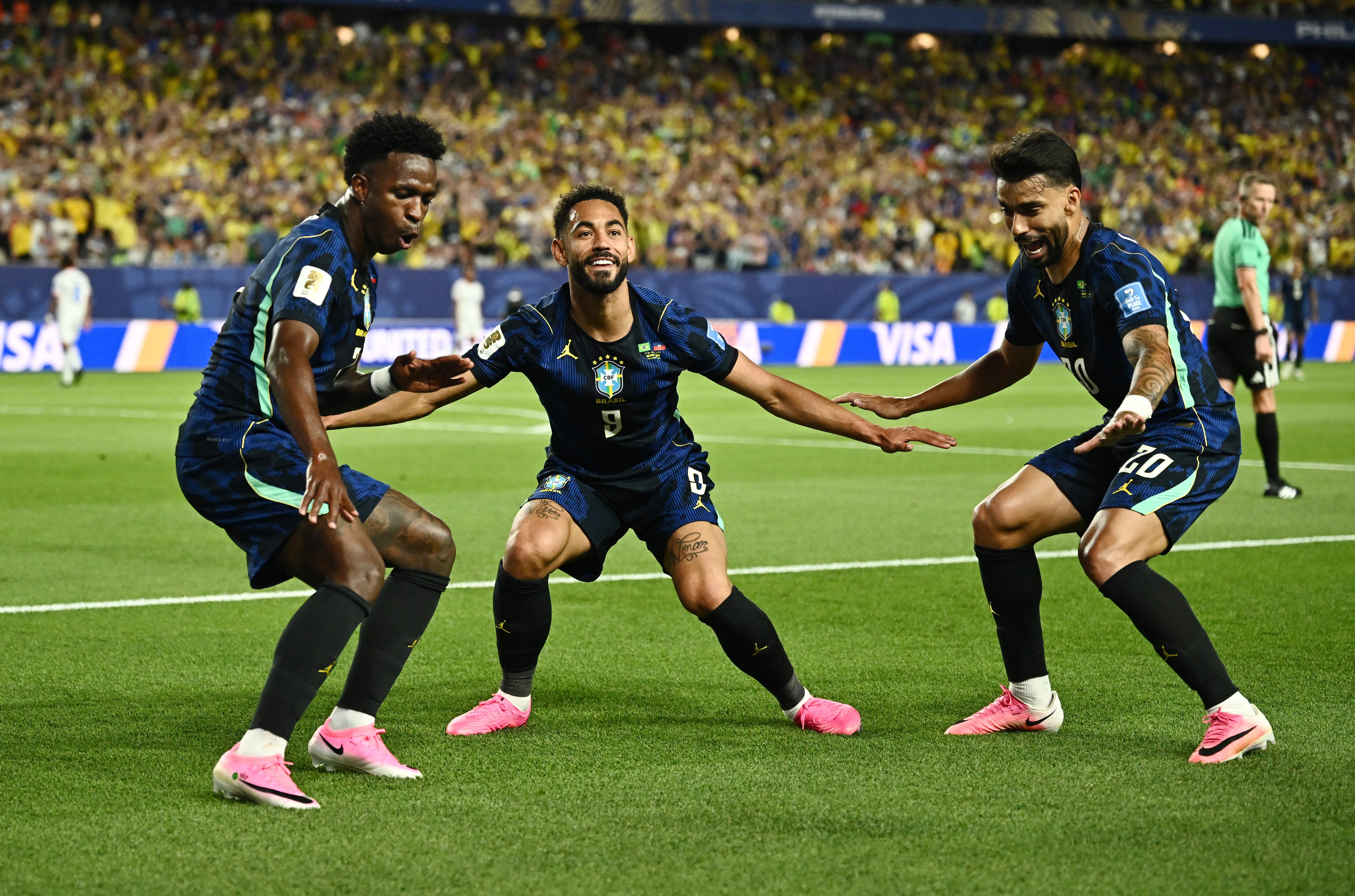 Soccer Football - FIFA World Cup 2026 - Group C - Brazil v Haiti - Philadelphia Stadium, Philadelphia, Pennsylvania, U.S. - June 19, 2026 Brazil's Matheus Cunha celebrates scoring their second goal with Vinicius Junior and Lucas Paqueta REUTERS/Dylan Martinez