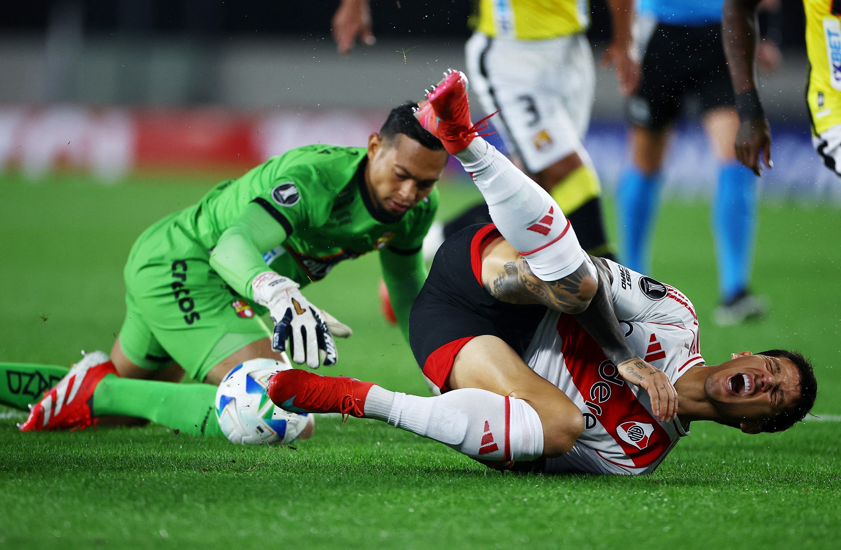 Barcelona SC's Jose Contreras fouls River Plate's Sebastian Driussi resulting in a penalty kick