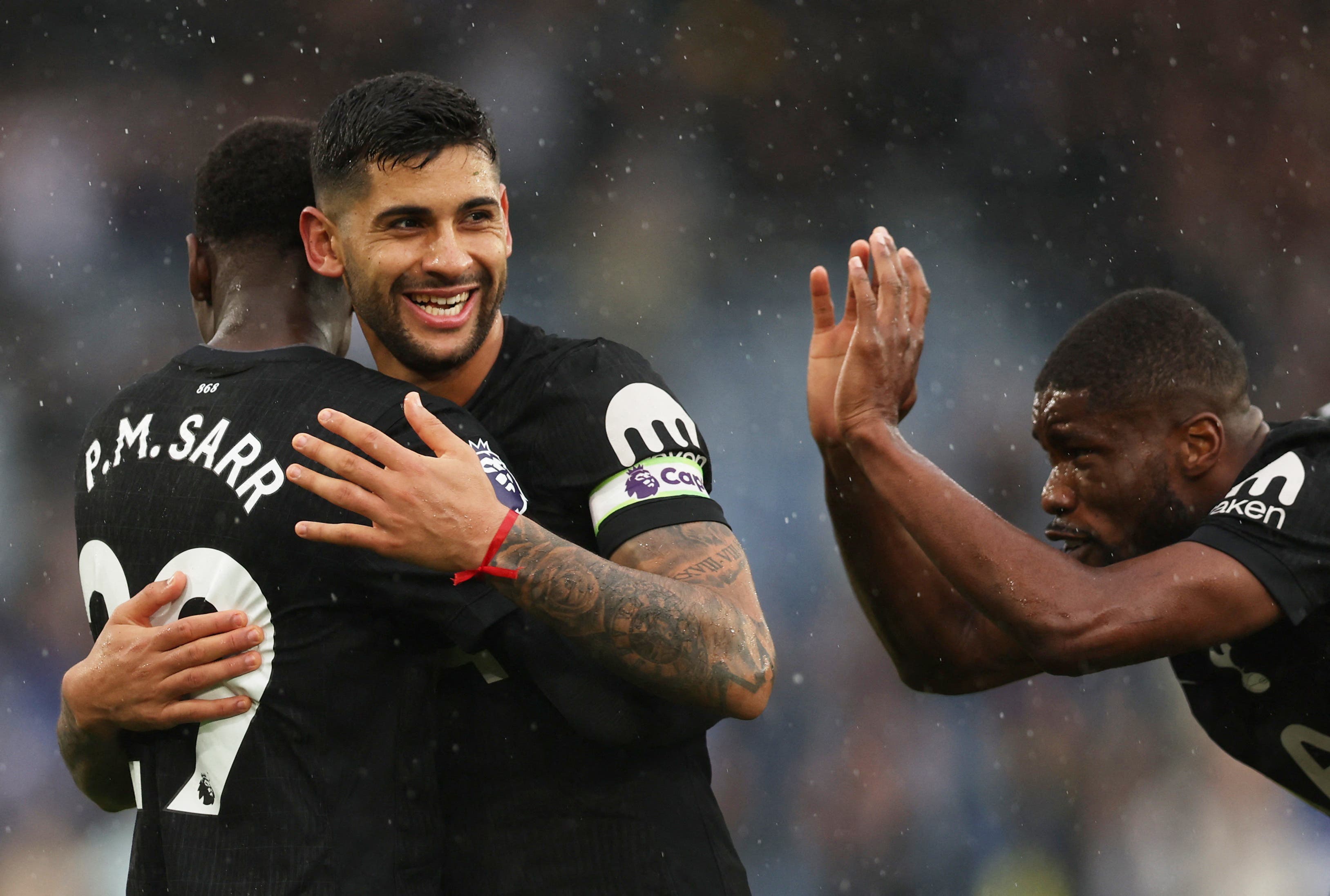 Soccer Football - Premier League - Leeds United v Tottenham Hotspur - Elland Road, Leeds, Britain - October 4, 2025 Tottenham Hotspur's Cristian Romero, Pape Matar Sarr and Kevin Danso celebrate after the match REUTERS/Chris Radburn