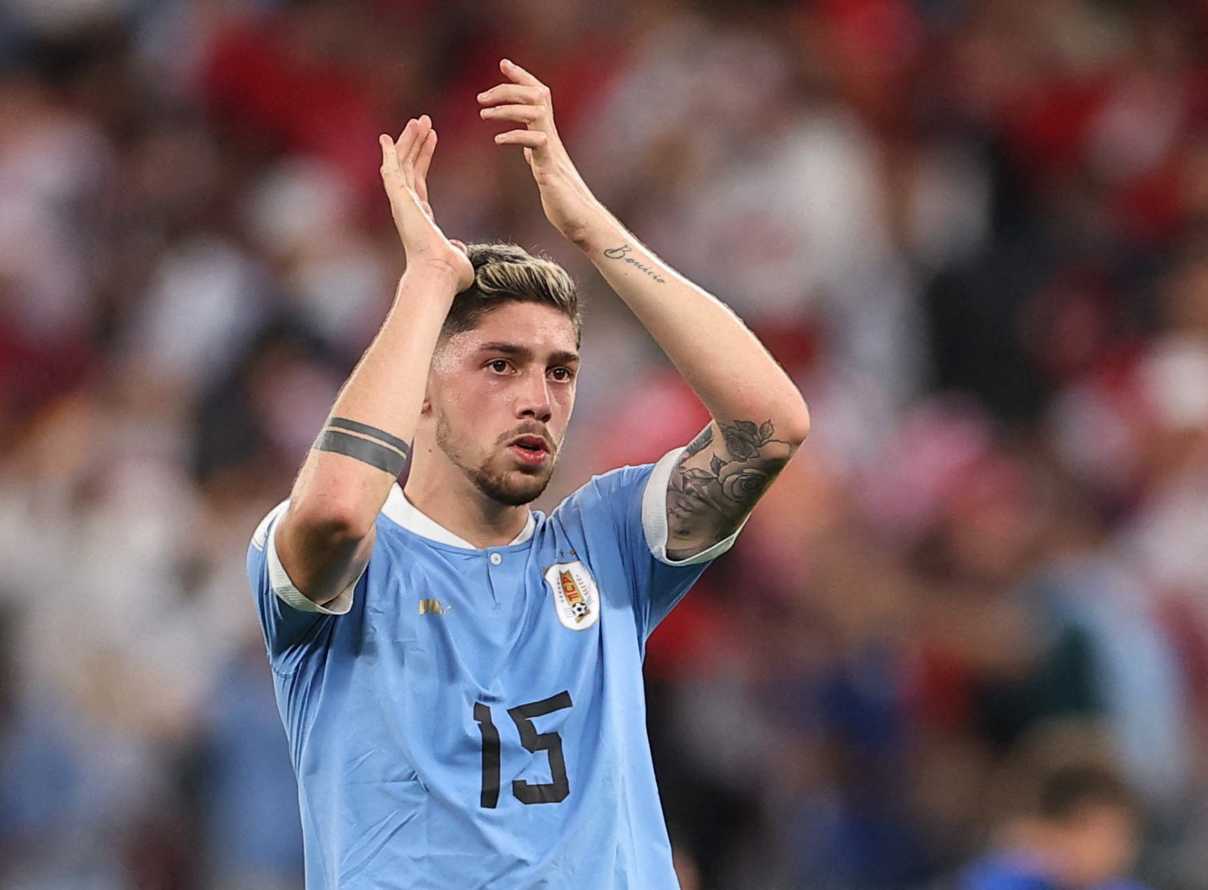 Soccer Football - FIFA World Cup Qatar 2022 - Group H - Uruguay v South Korea - Education City Stadium, Al Rayyan, Qatar - November 24, 2022 Uruguay's Federico Valverde applauds fans after the match REUTERS/Kim Hong-Ji