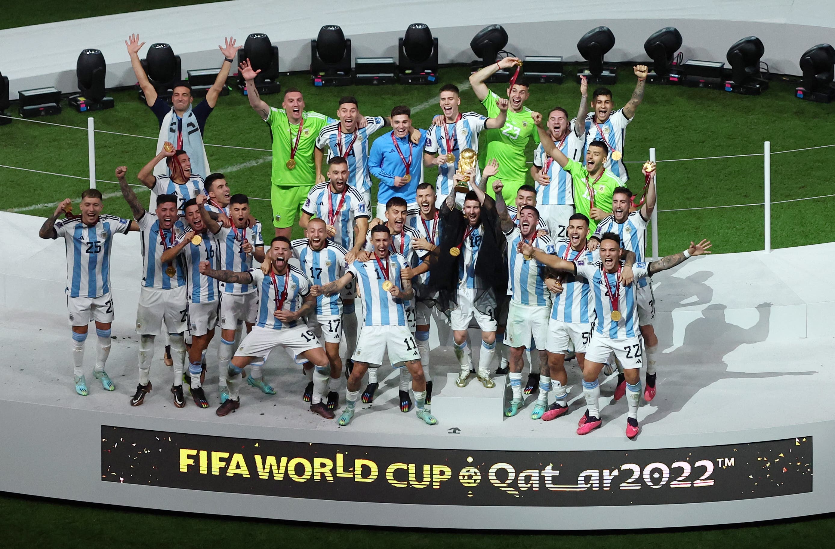  Argentina's Lionel Messi celebrates with the trophy after winning the World Cup 