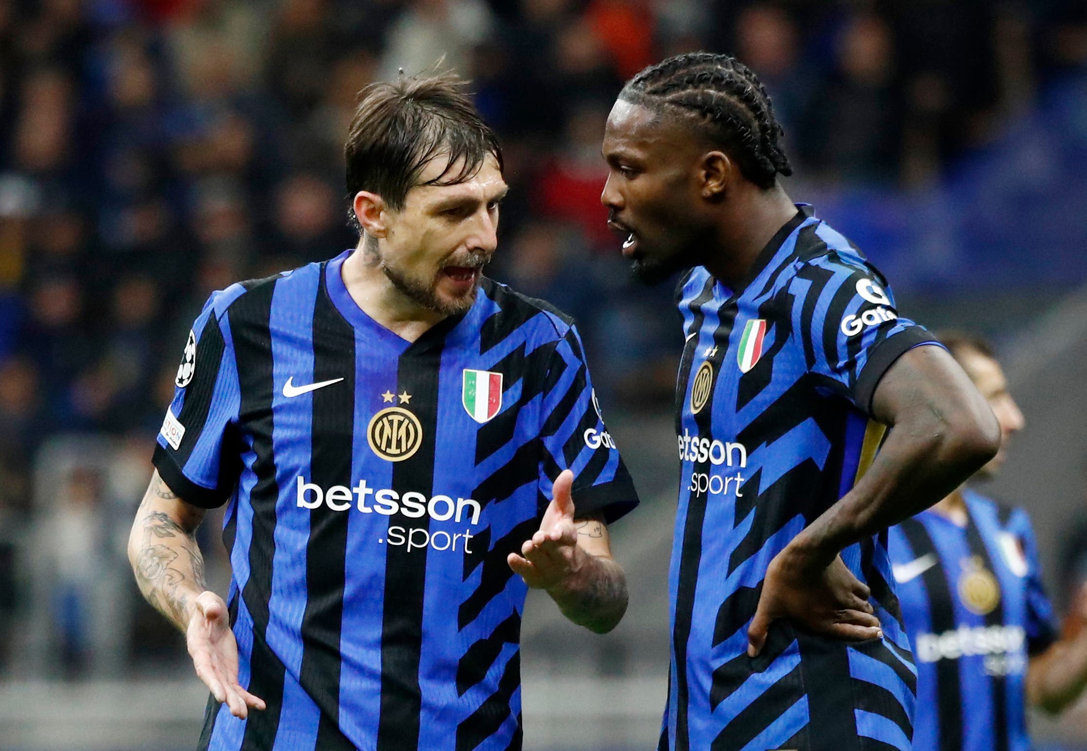 Soccer Football - Champions League - Quarter Final - Second Leg - Inter Milan v Bayern Munich - San Siro, Milan, Italy - April 16, 2025 Inter Milan's Francesco Acerbi and Marcus Thuram REUTERS/Alessandro Garofalo