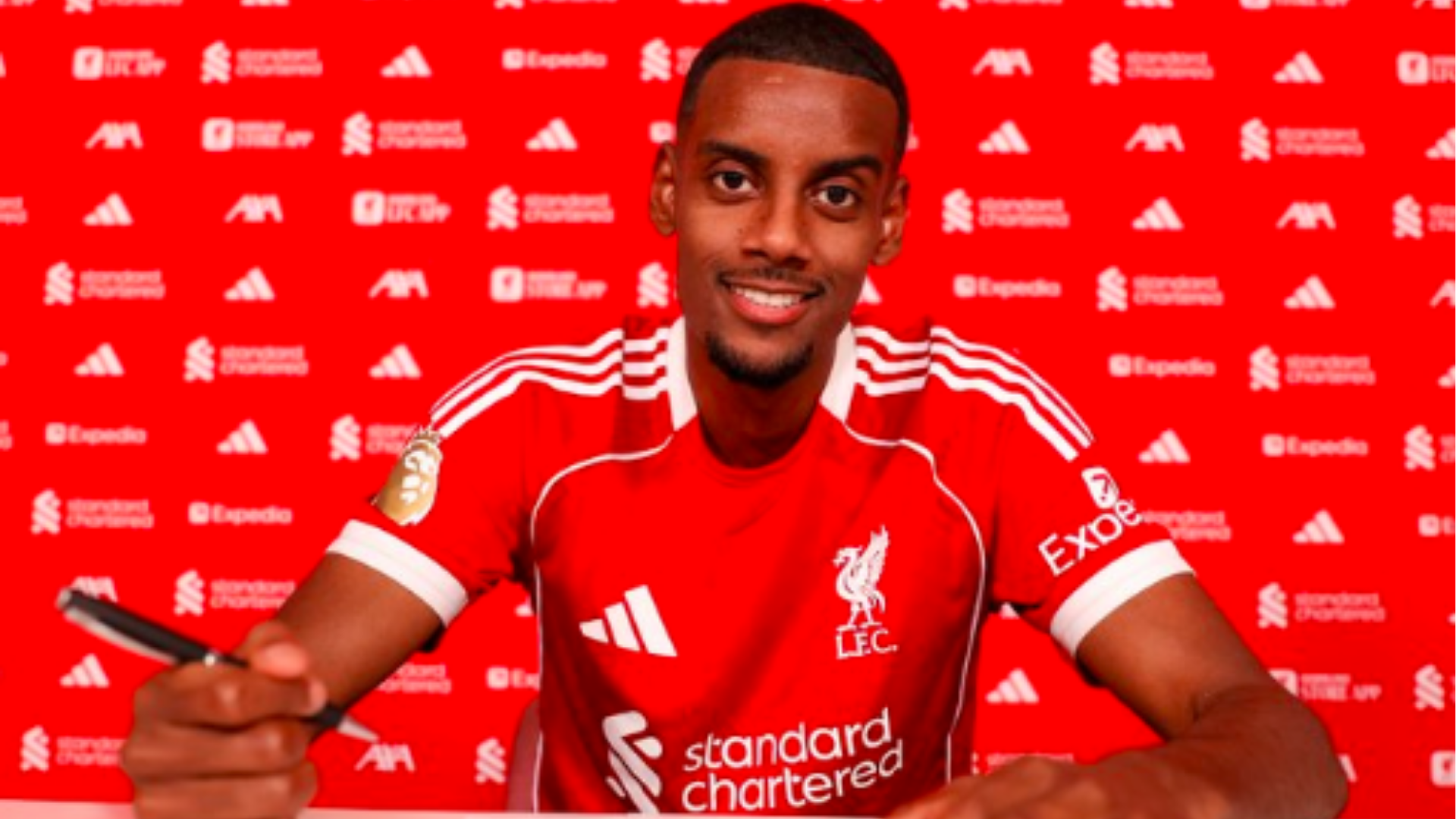 Alexander Isak during his contract signing act with Liverpool.