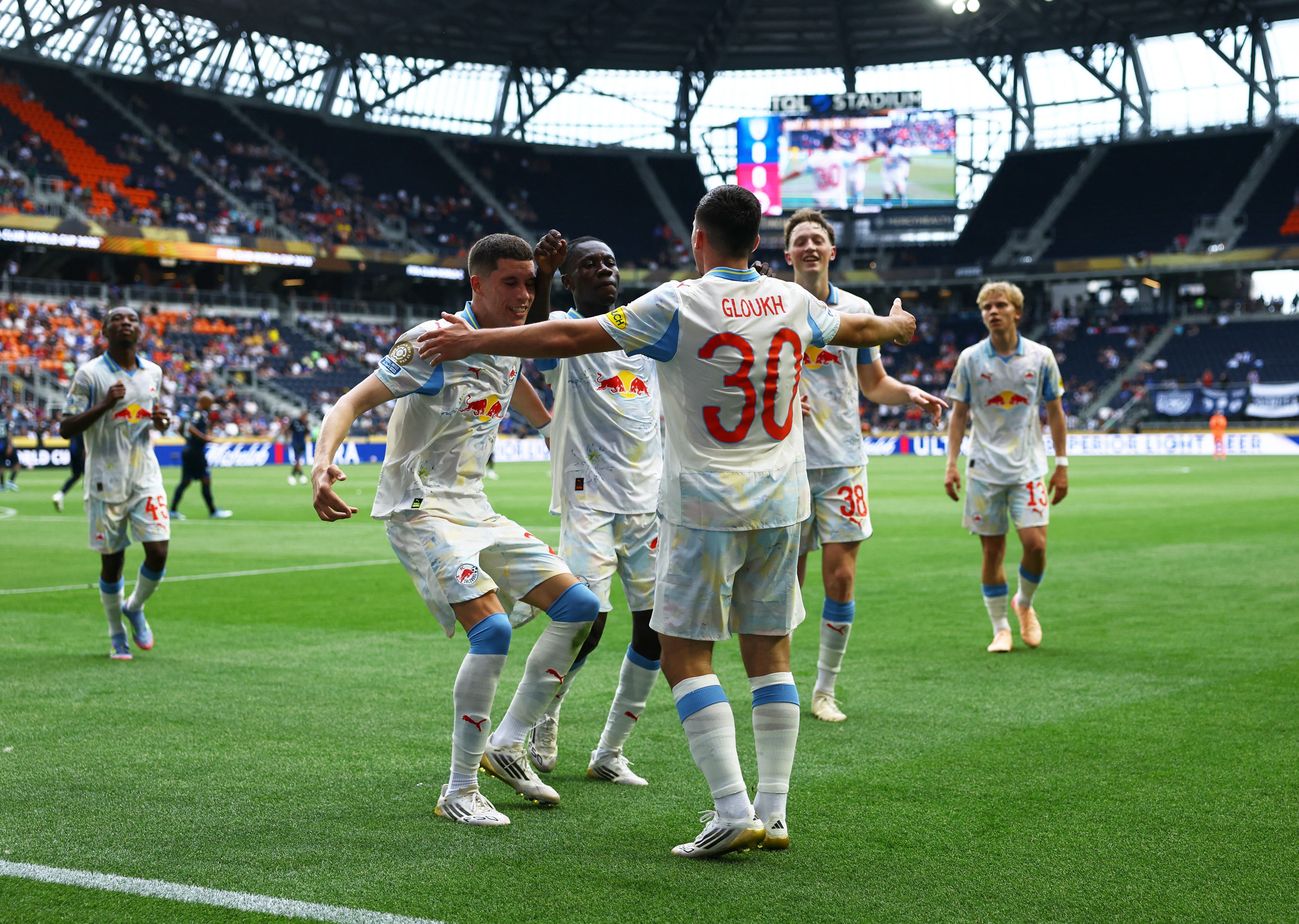 RB Salzburg&#x27;s Oscar Gloukh celebrates scoring their first goal with teammates 