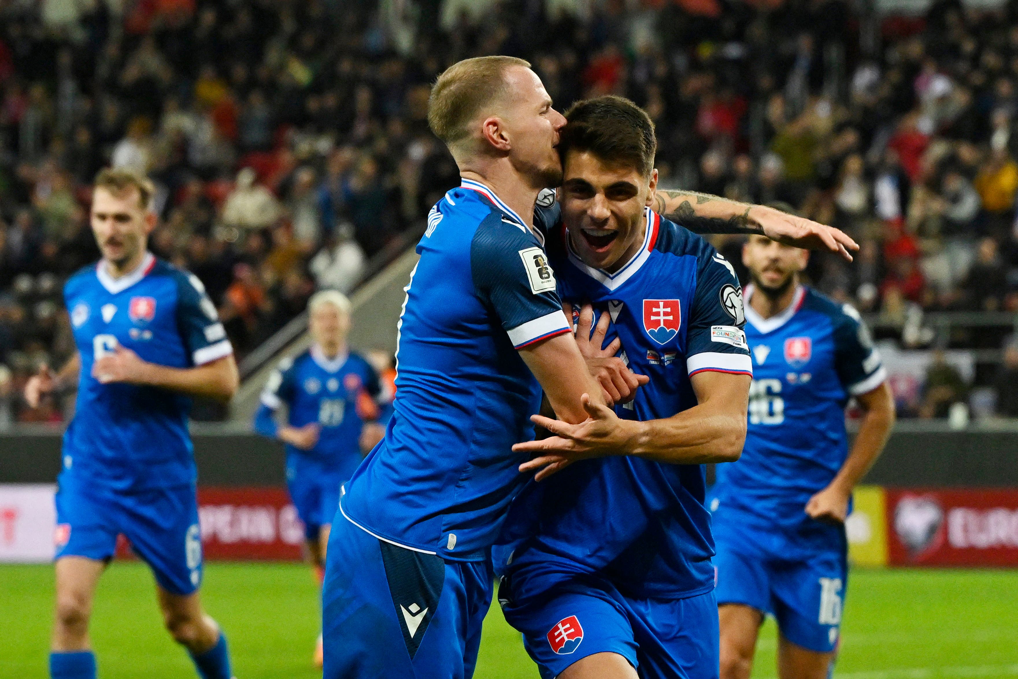 Soccer Football - FIFA World Cup - UEFA Qualifiers - Group A - Slovakia v Luxembourg - Anton Malatinsky Stadium, Trnava, Slovakia - October 13, 2025 Slovakia's Adam Obert celebrates scoring their first goal with Ondrej Duda REUTERS/Radovan Stoklasa
