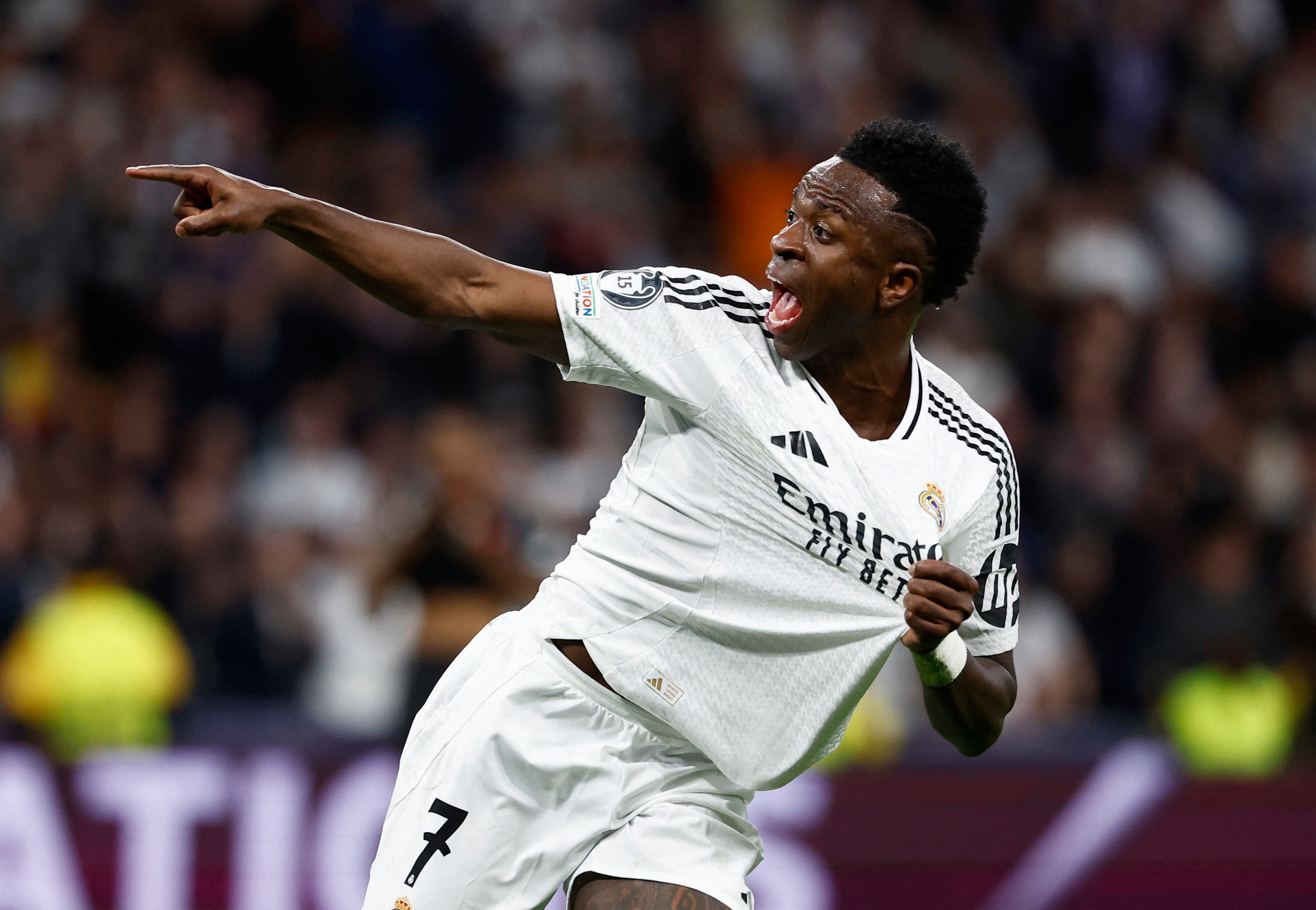 Soccer Football - Champions League - Quarter Final - Second Leg - Real Madrid v Arsenal - Santiago Bernabeu, Madrid, Spain - April 16, 2025 Real Madrid's Vinicius Junior celebrates scoring their first goal REUTERS/Juan Medina
