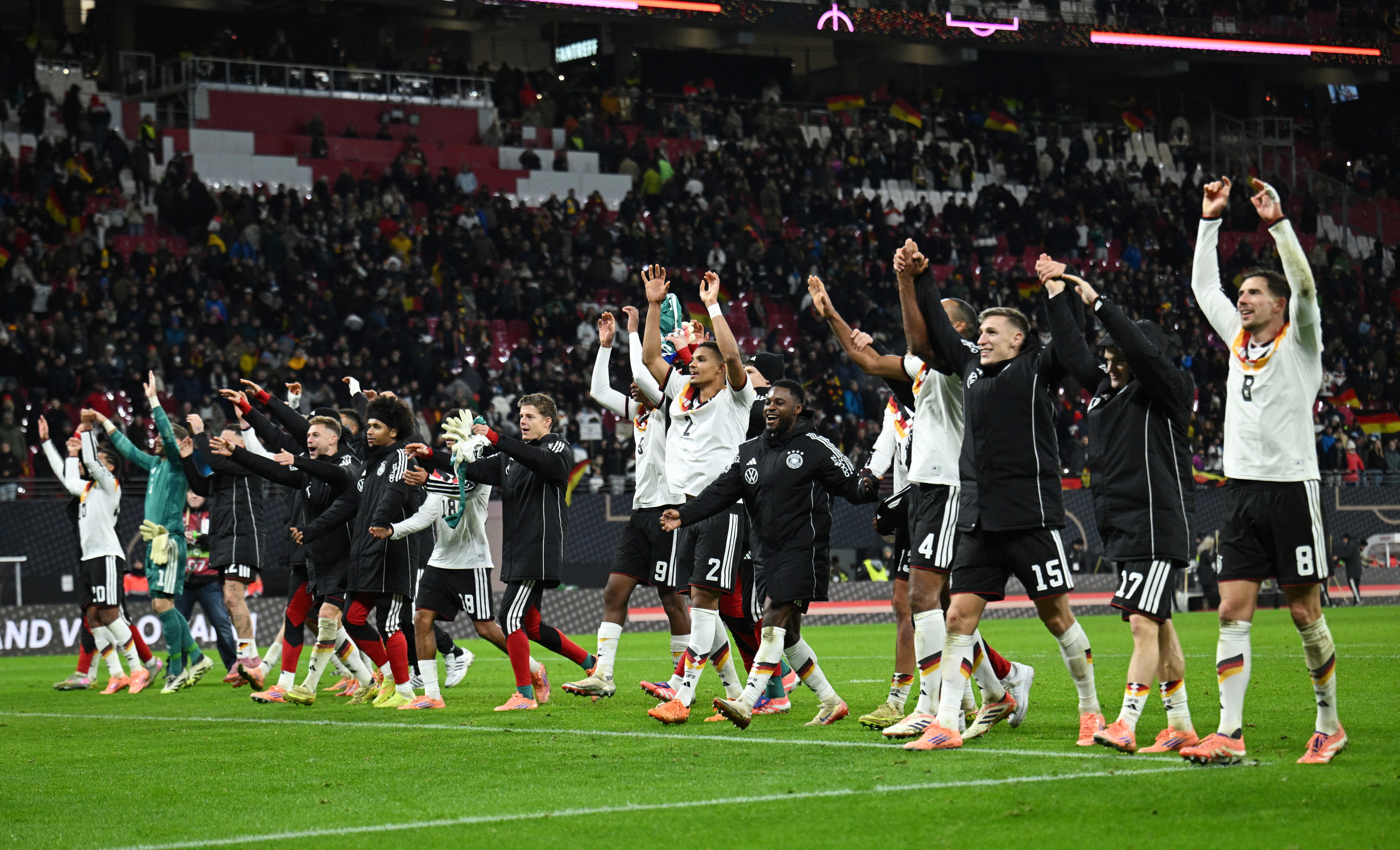 Soccer Football - World Cup - UEFA Qualifiers - Group A - Germany v Slovakia - Red Bull Arena, Leipzig, Germany - November 17, 2025 Germany players celebrate with their fans after winning their group to qualify for the World Cup finals REUTERS/Annegret Hilse
