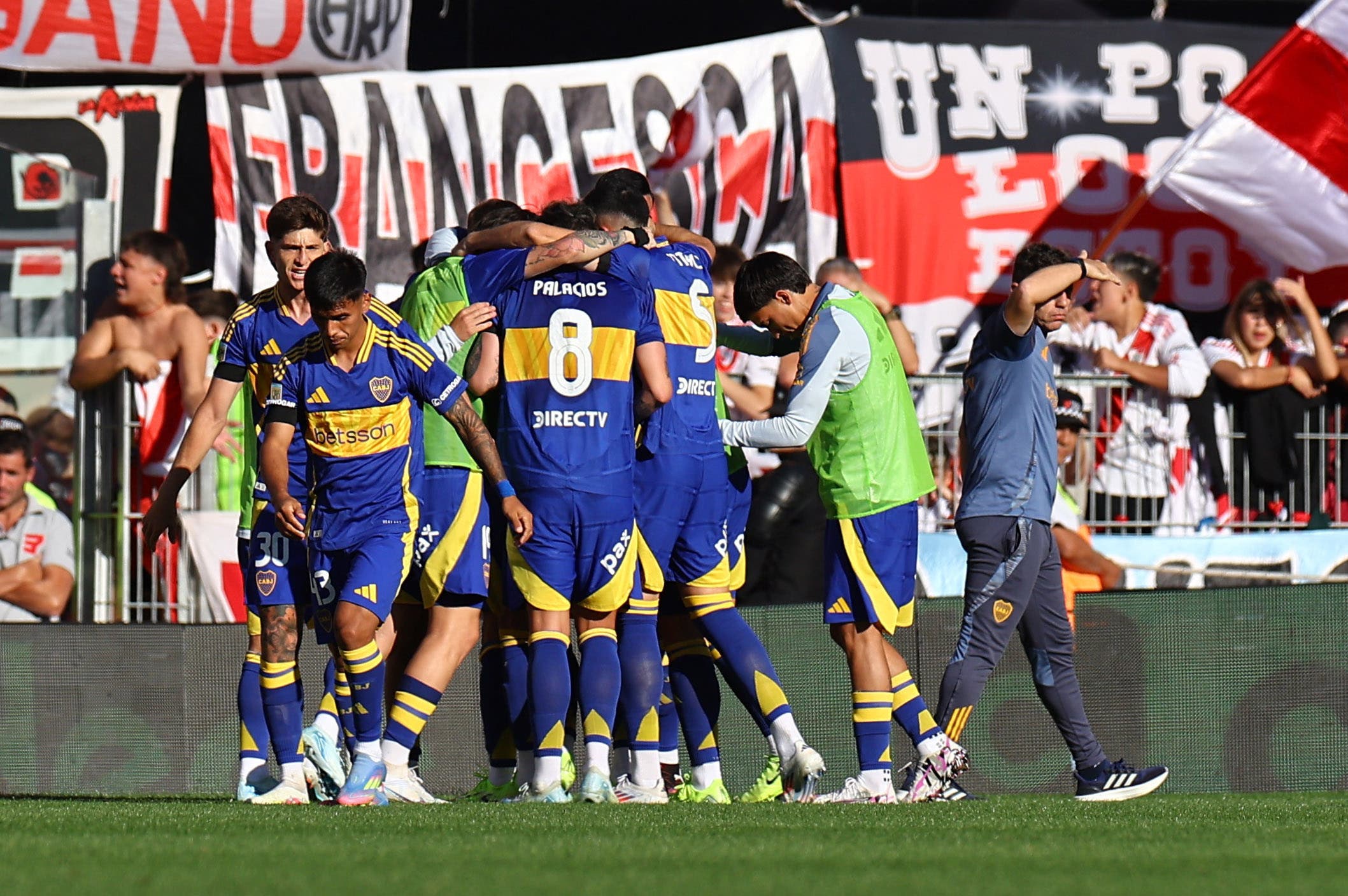 Boca Juniors' Miguel Merentiel celebrates scoring their first goal with teammates