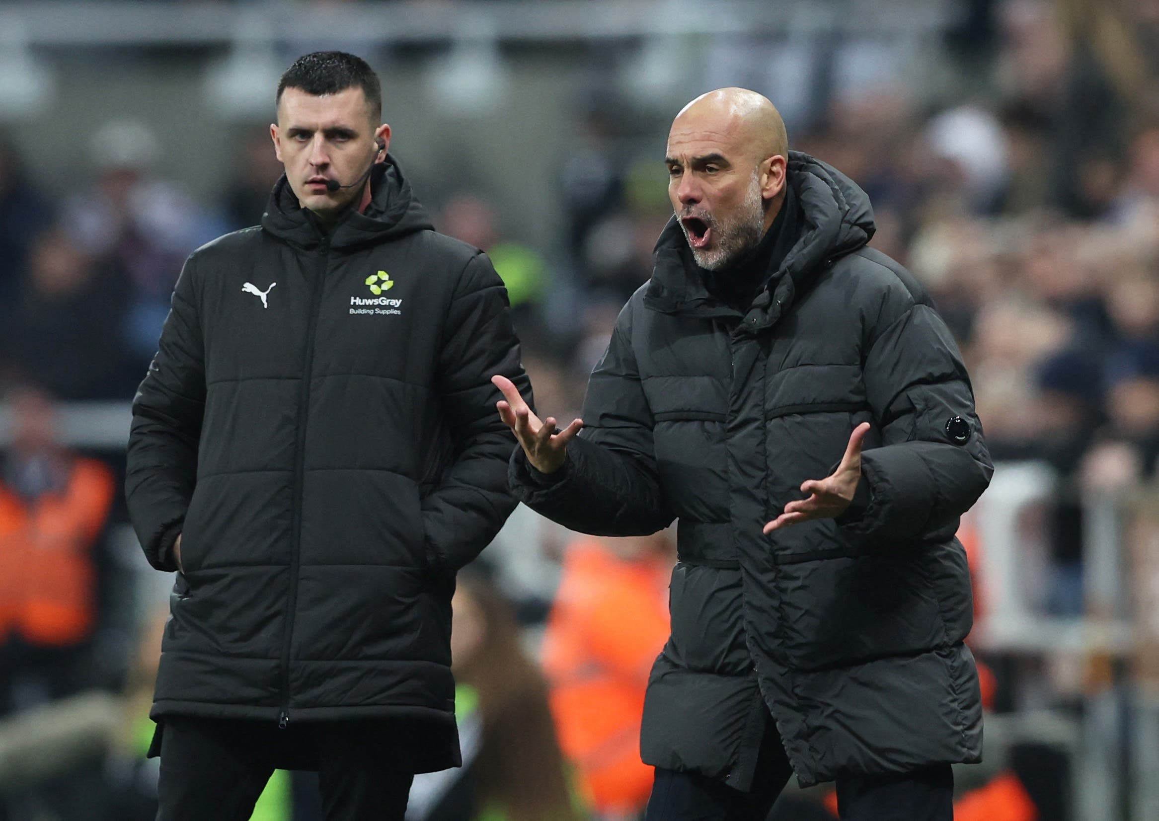 Soccer Football - FA Cup - Fifth Round - Newcastle United v Manchester City - St James' Park, Newcastle, Britain - March 7, 2026 Manchester City manager Pep Guardiola reacts as the fourth official looks on REUTERS/Scott Heppell