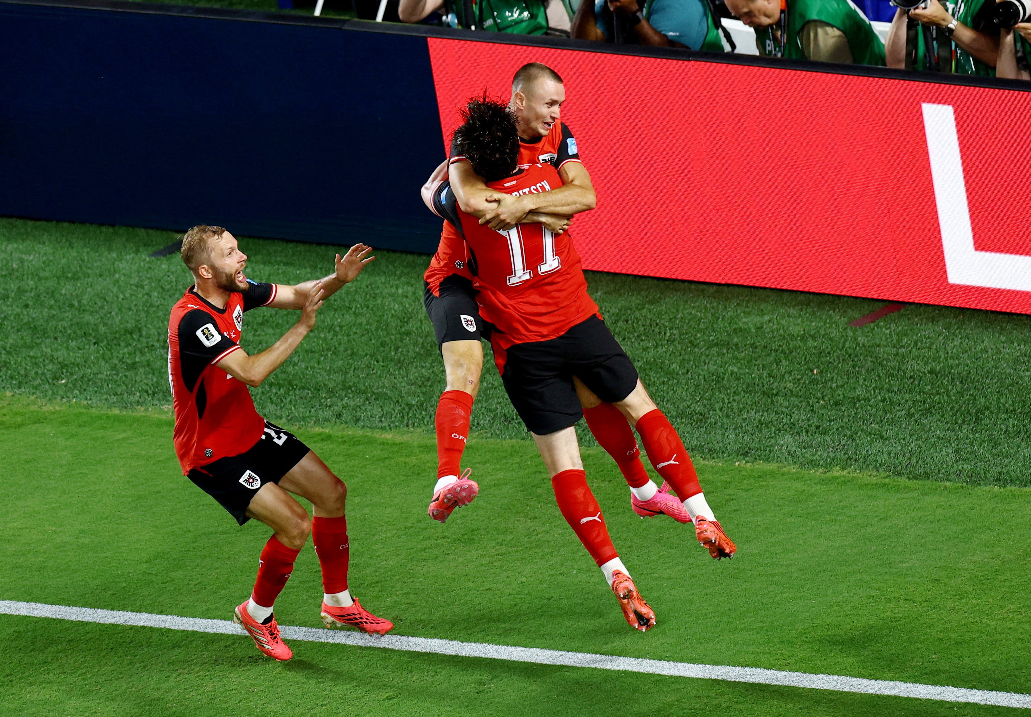 Soccer Football - FIFA World Cup 2026 - Group J - Algeria v Austria - Kansas City Stadium, Kansas City, Missouri, U.S. - June 27, 2026 Austria's Sasa Kalajdzic celebrates scoring their third goal with Konrad Laimer and Michael Gregoritsch REUTERS/Pedro Nunes REFILE - CORRECTING INFORMATION

