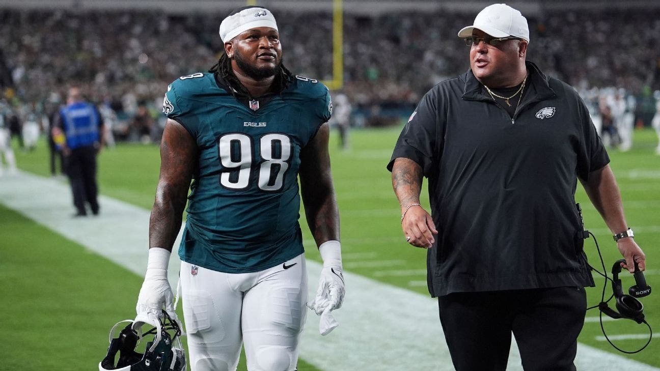 Jalen Carter leaves the field after being ejected for spitting on Dak Prescott.