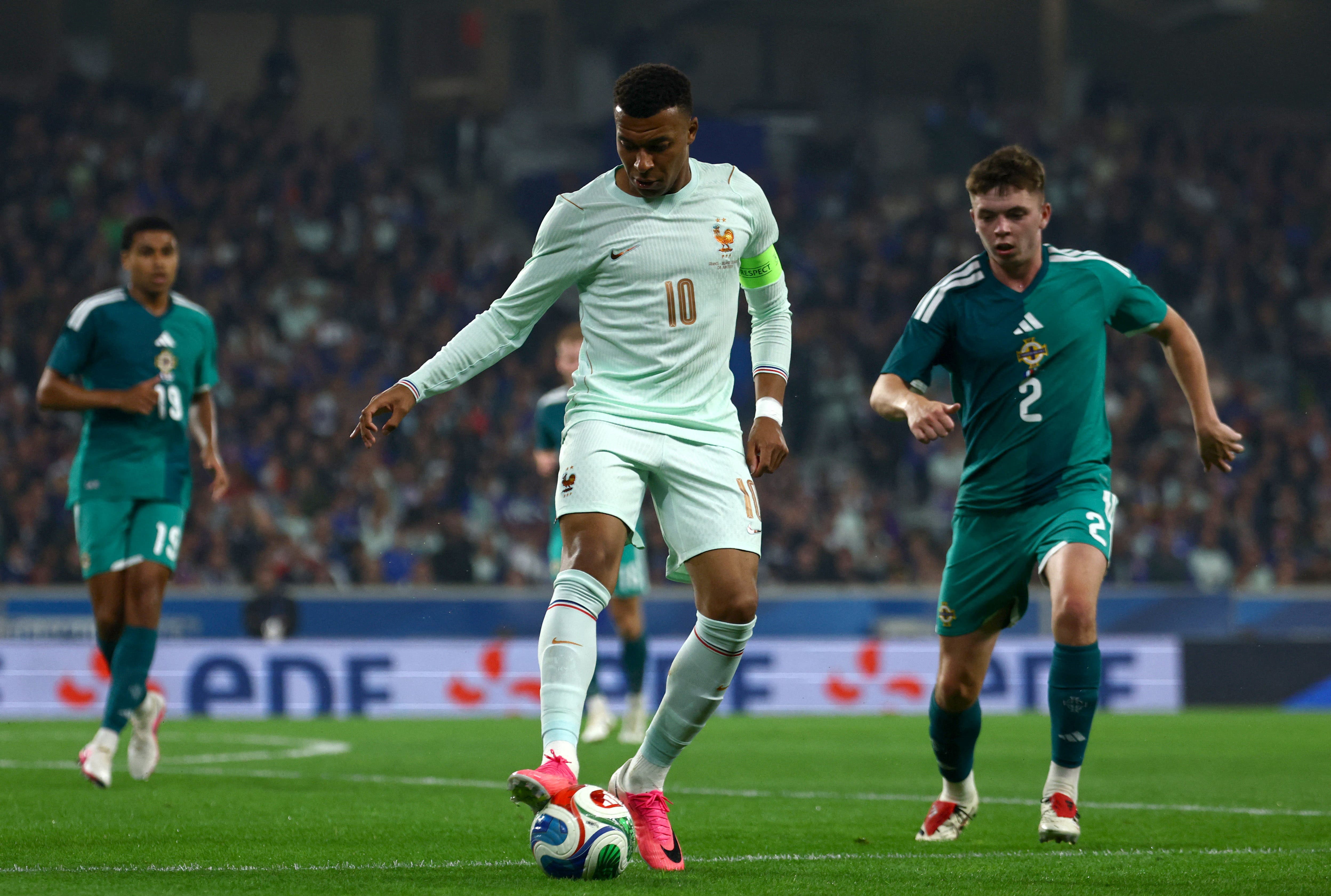 Soccer Football - International Friendly - France v Northern Ireland - Decathlon Arena Stade Pierre-Mauroy, Villeneuve-d'Ascq, France - June 8, 2026 France's Kylian Mbappe in action with Northern Ireland's Patrick Kelly REUTERS/Sarah Meyssonnier