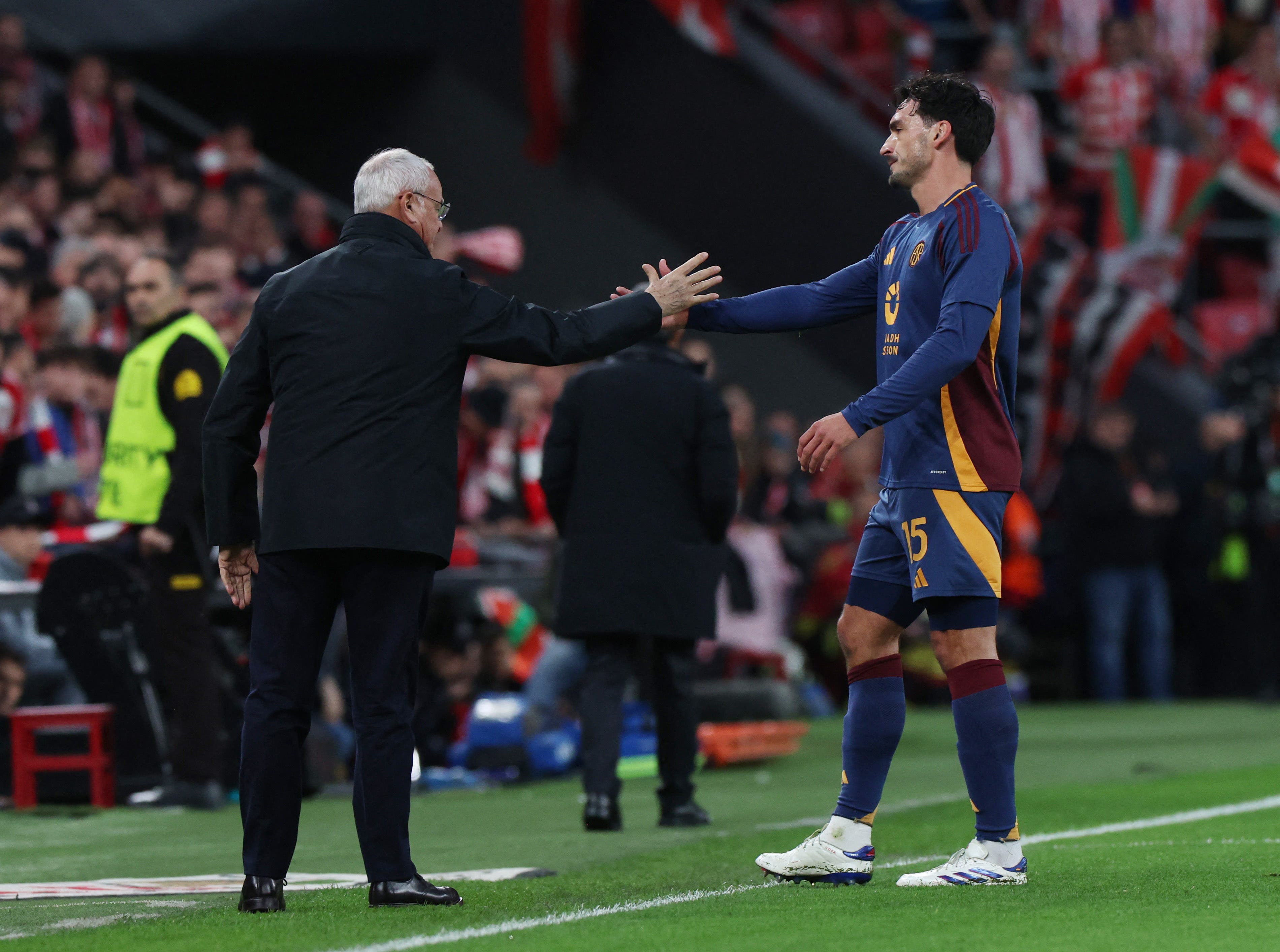 AS Roma coach Claudio Ranieri shakes hands with Mats Hummels after he was sent off 