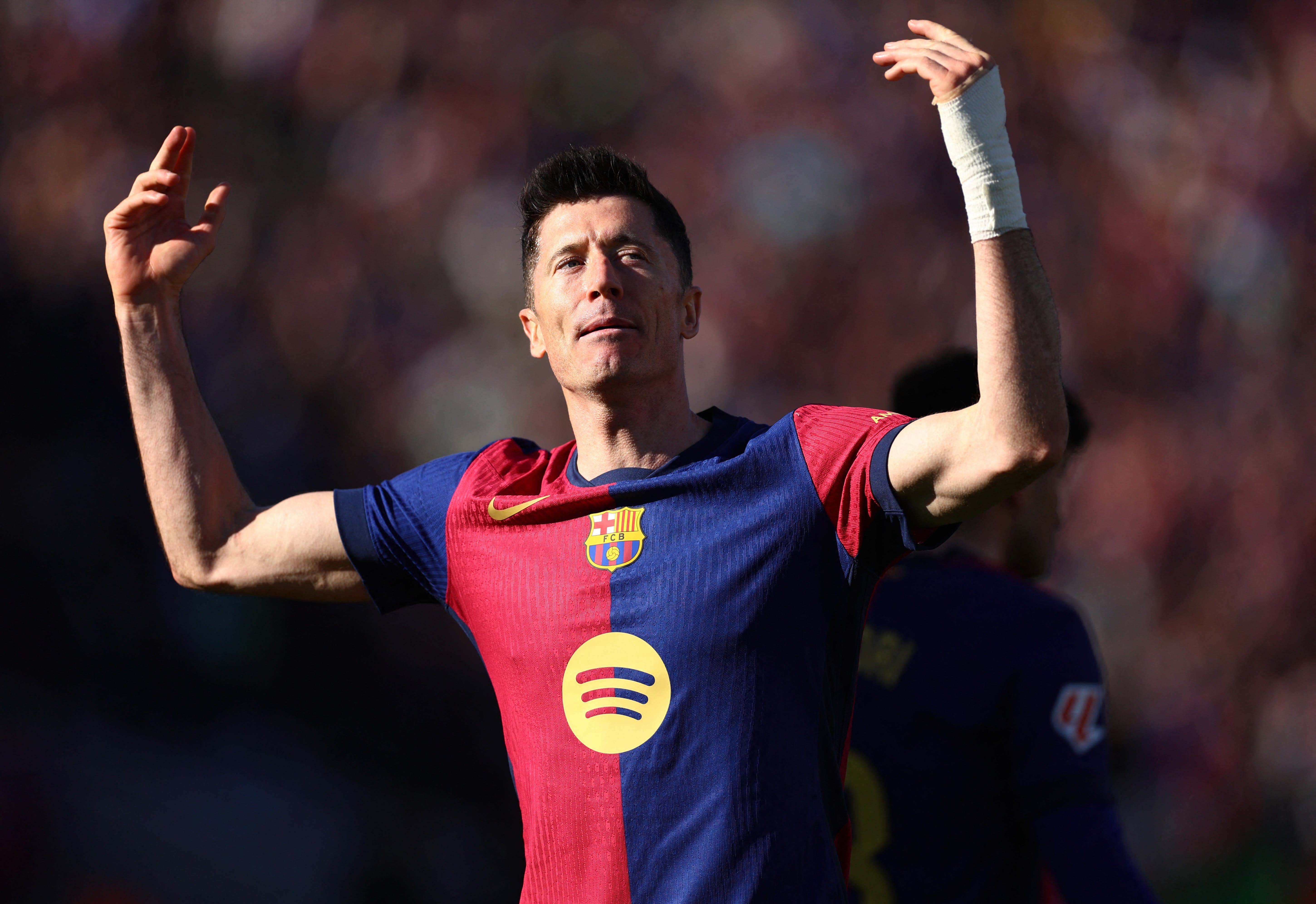 Robert Lewandowski celebrates a goal during a match for Barcelona.