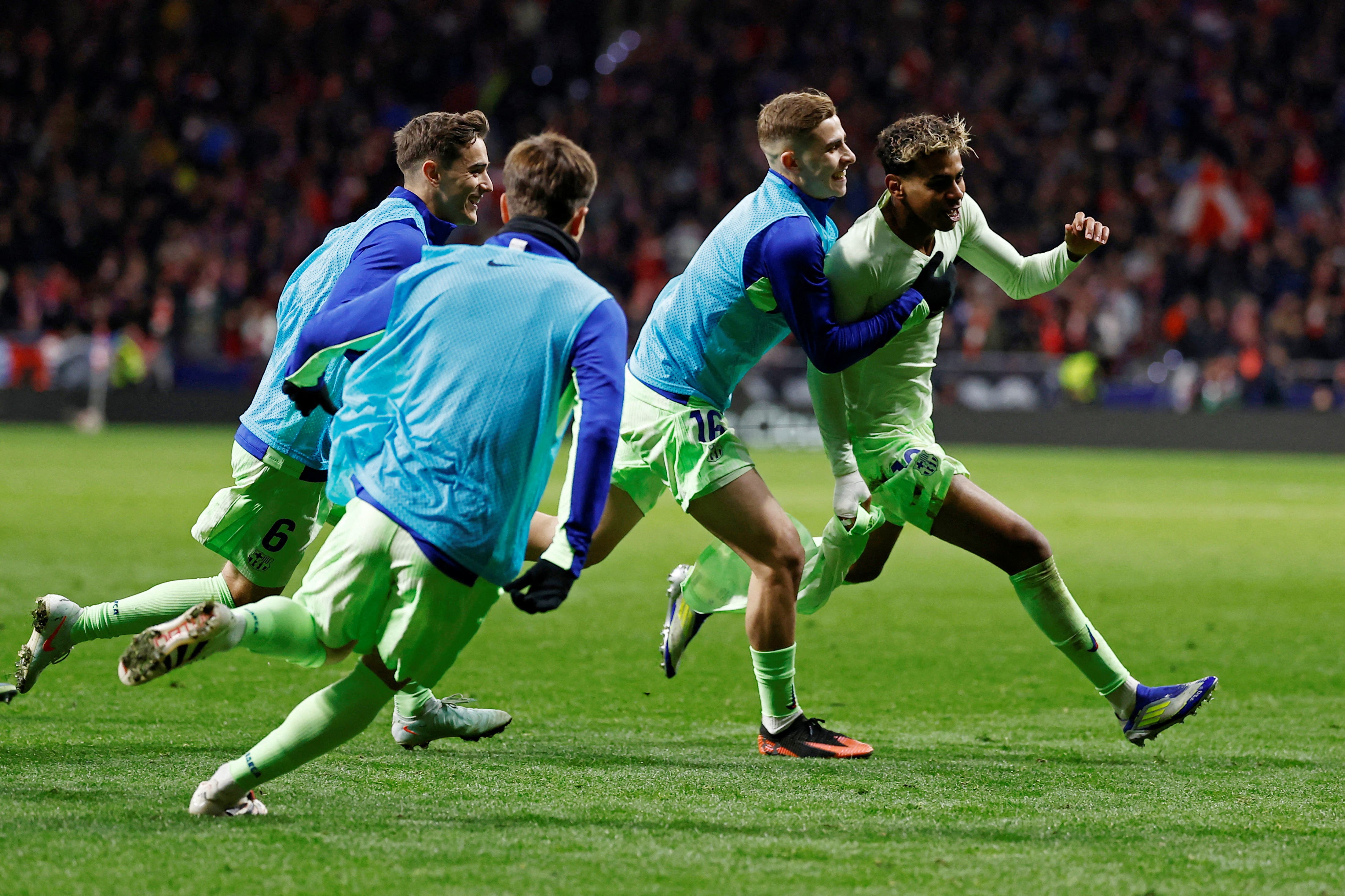 FC Barcelona's Lamine Yamal celebrates scoring their third goal with teammates