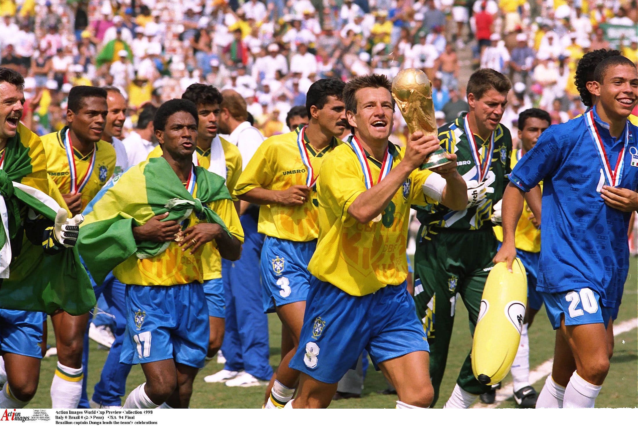 Football - 1994 FIFA World Cup - Final - Italy v Brazil - Rose Bowl, Los Angeles - 17/7/94 Brazil captain Dunga leads the team's celebrations Mandatory Credit: Action Images