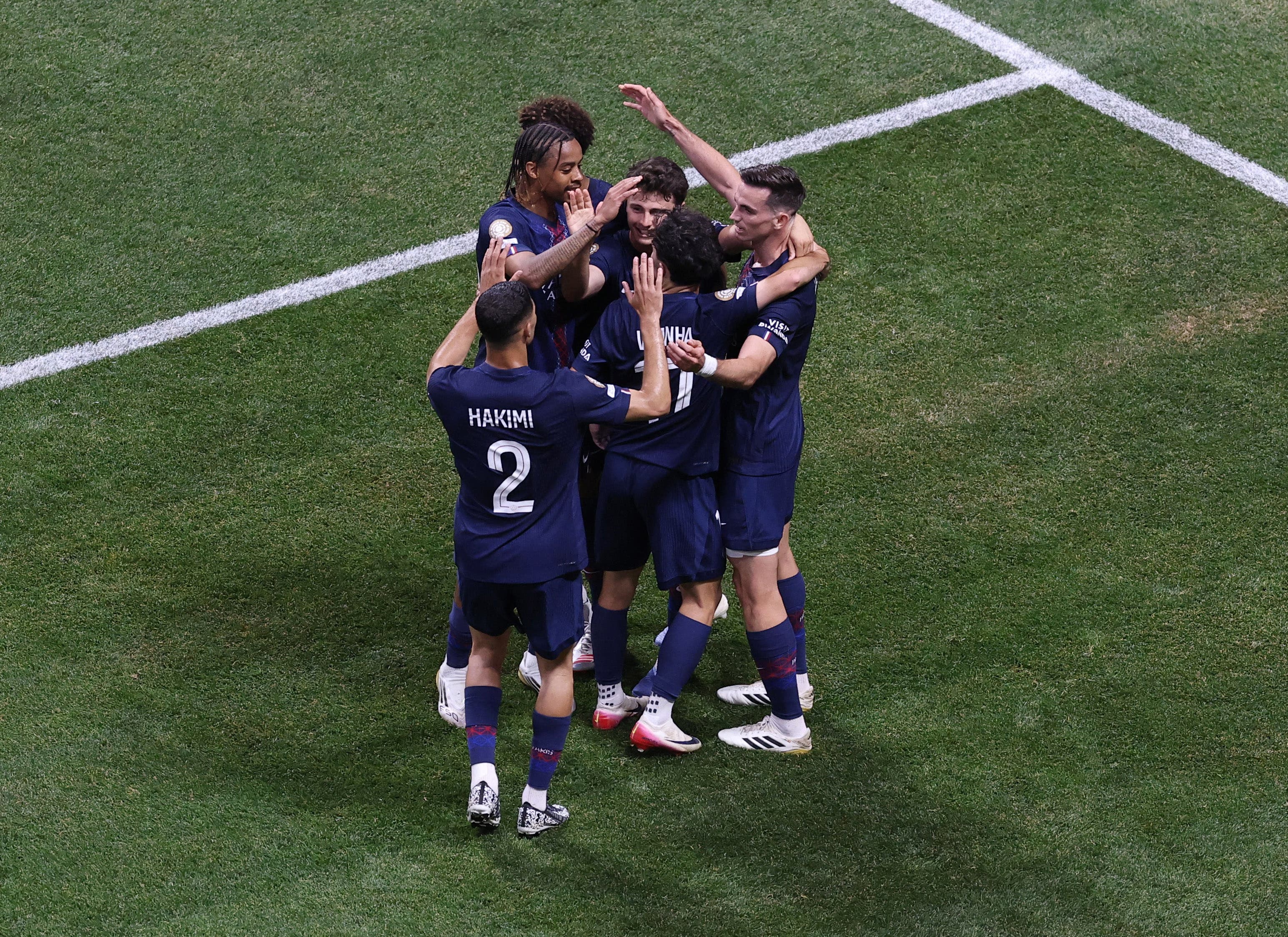 Paris St Germain's Joao Neves celebrates scoring their second goal with teammates