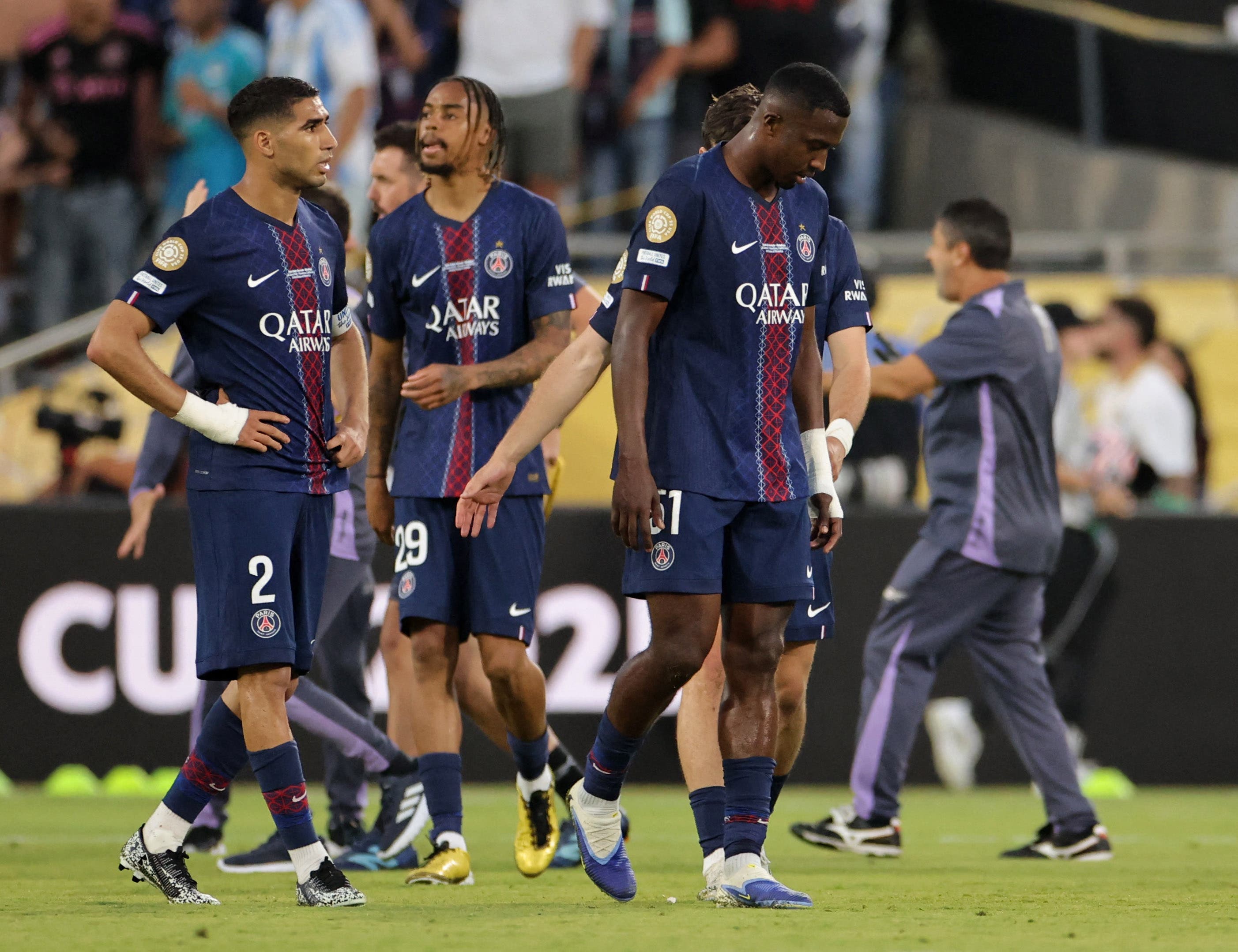 Paris St Germain's Achraf Hakimi, Bradley Barcola and Willian Pacho look dejected after the match