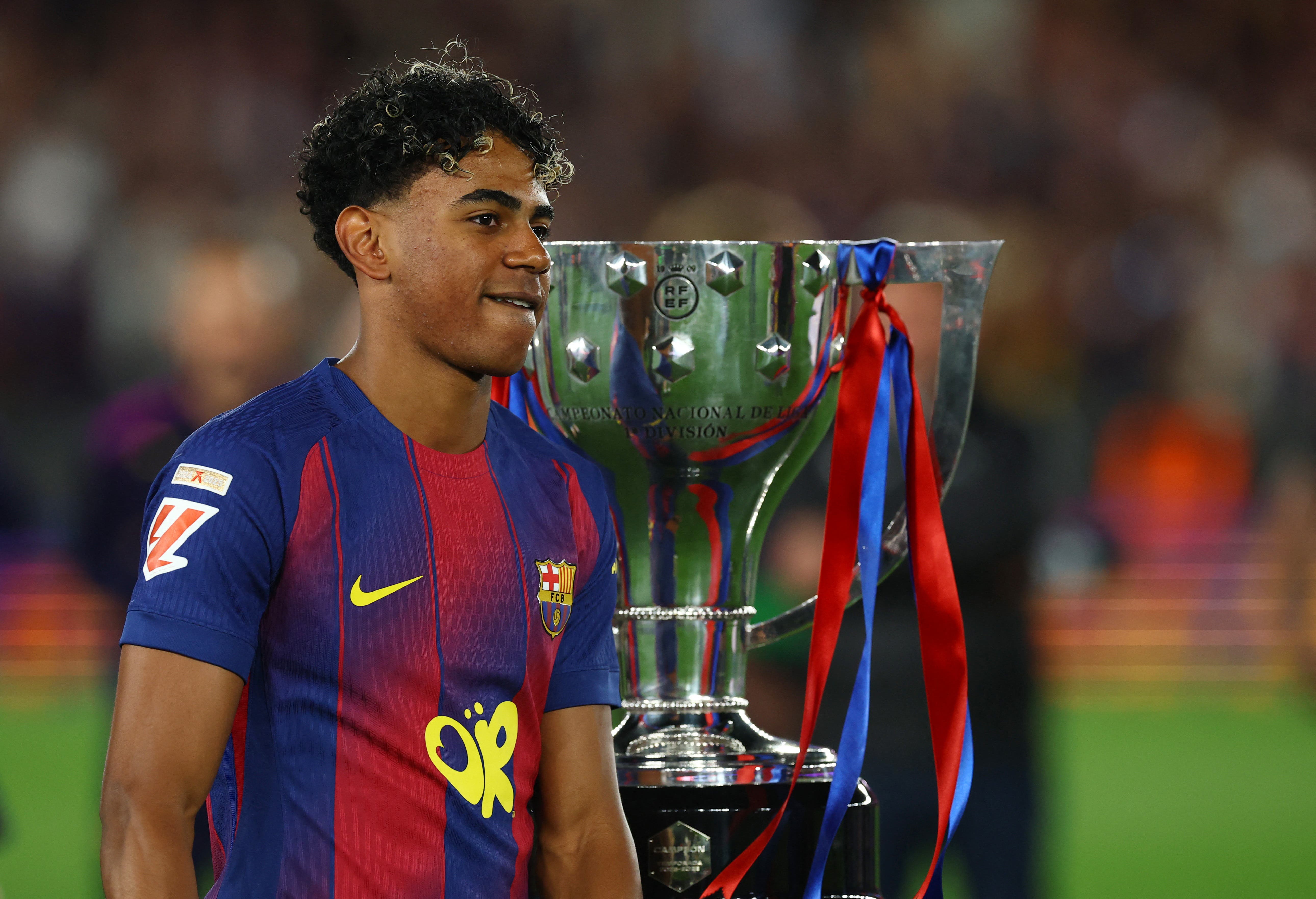 Soccer Football - LaLiga - FC Barcelona v Real Madrid - Spotify Camp Nou, Barcelona, Spain - May 10, 2026 FC Barcelona's Lamine Yamal celebrates next to the trophy after winning the LaLiga REUTERS/Albert Gea