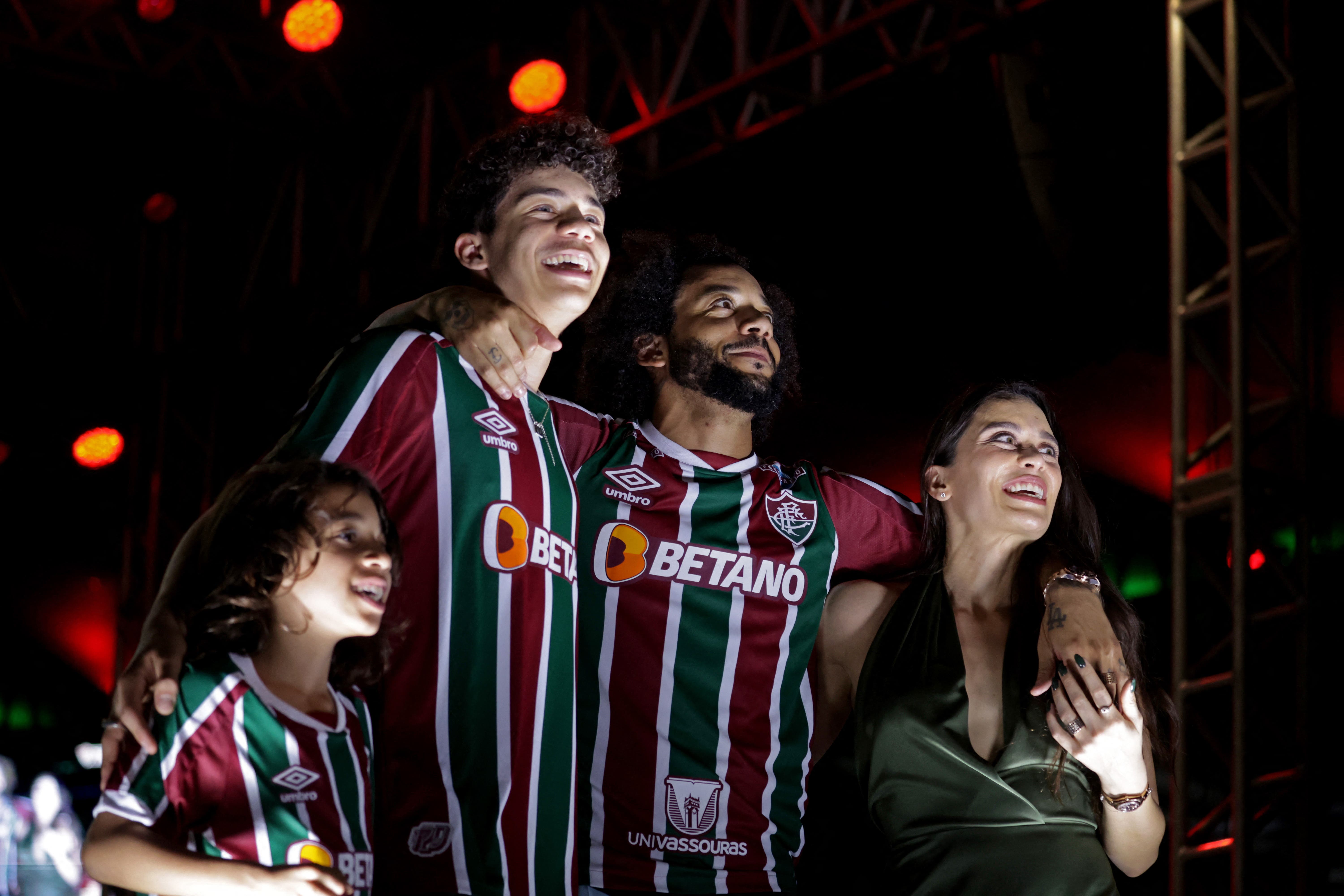 Soccer Football - Marcelo signs for Fluminense - Maracana Stadium, Rio de Janeiro, Brazil - March 10, 2023 Marcelo with his wife Clarice Alves and sons Liam and Enzo during his presentation ceremony REUTERS/Pilar Olivares