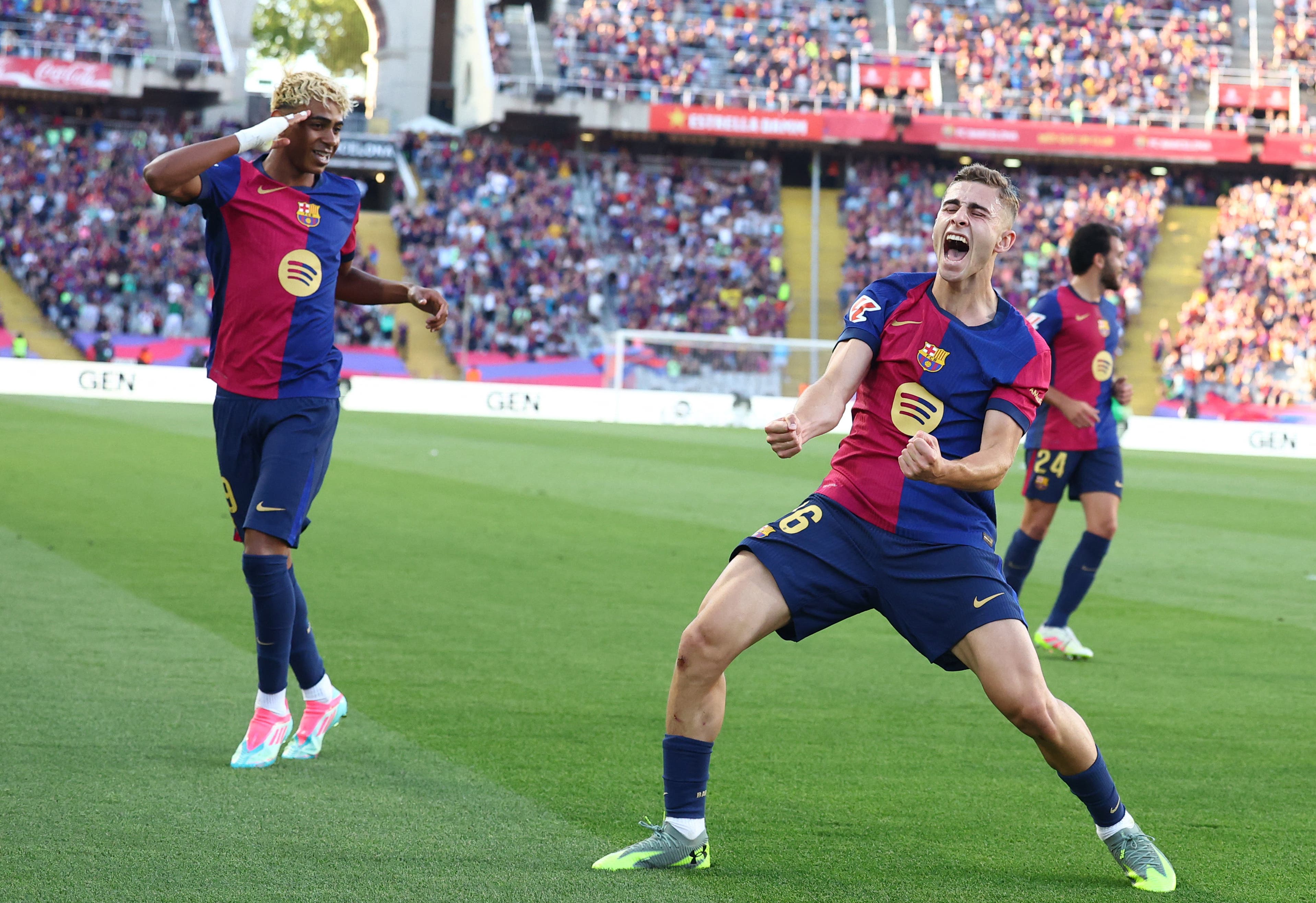 Soccer Football - LaLiga - FC Barcelona v Villarreal - Estadi Olimpic Lluis Companys, Barcelona, Spain - May 18, 2025 FC Barcelona's Fermin Lopez celebrates scoring their second goal with FC Barcelona's Lamine Yamal REUTERS/Albert Gea
