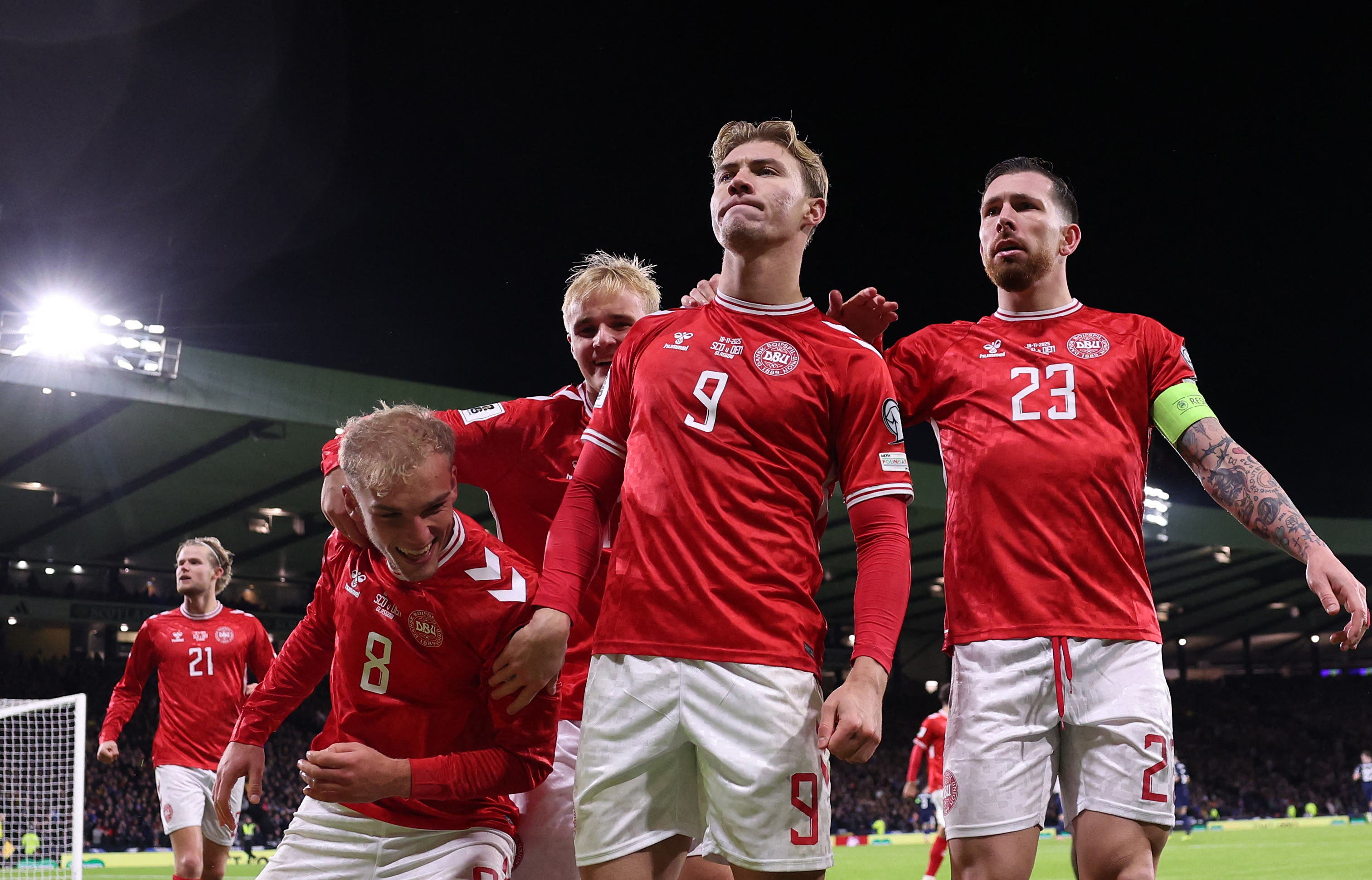 Soccer Football - FIFA World Cup - UEFA Qualifiers - Group C - Scotland v Denmark - Hampden Park, Glasgow, Scotland, Britain - November 18, 2025 Denmark's Rasmus Hojlund celebrates scoring their first goal with Gustav Isaksen, Victor Froholdt and Pierre-Emile Hojbjerg Action Images via Reuters/Lee Smith