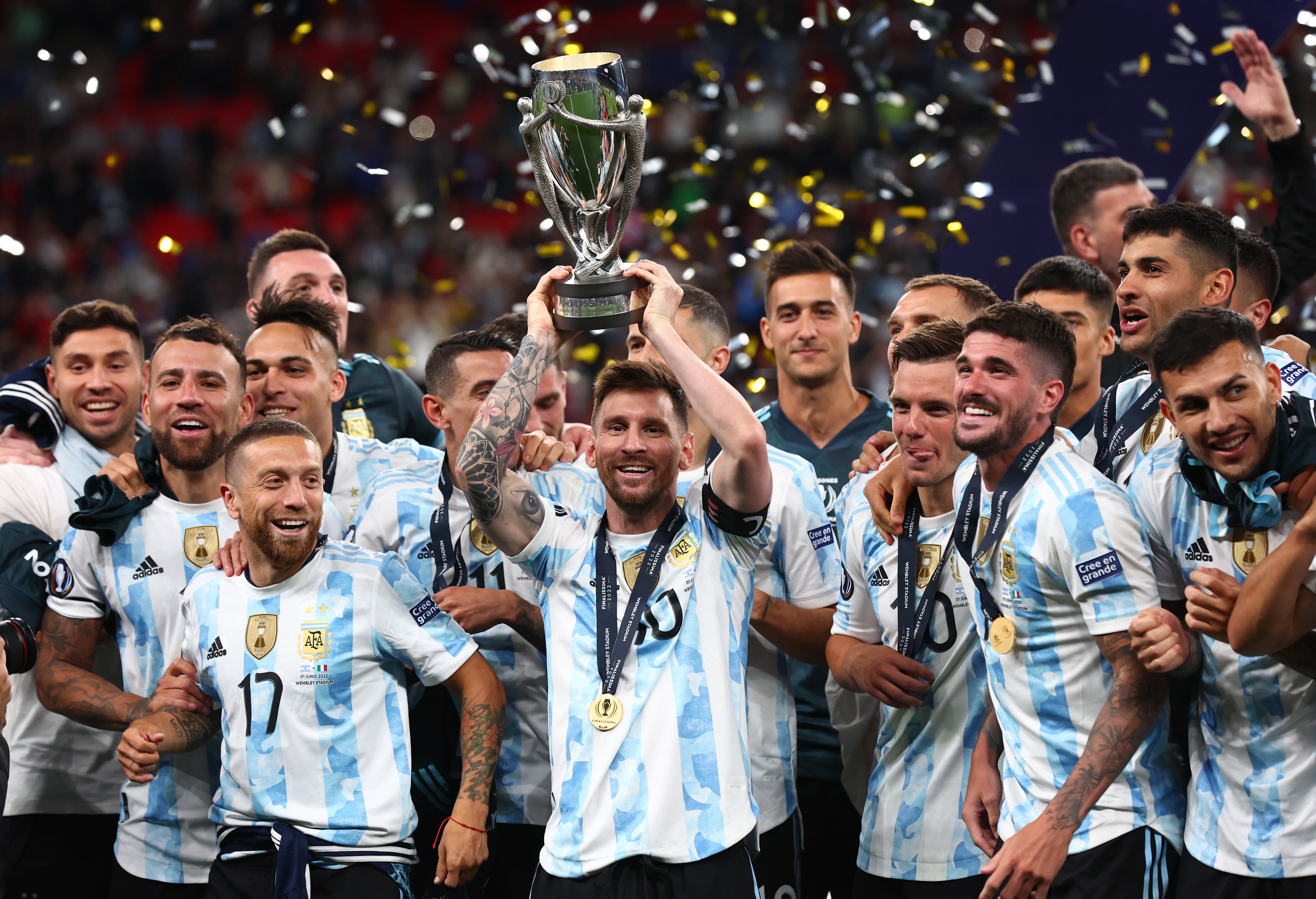 Argentina's Lionel Messi celebrates with the trophy and teammates after winning the Finalissima 
