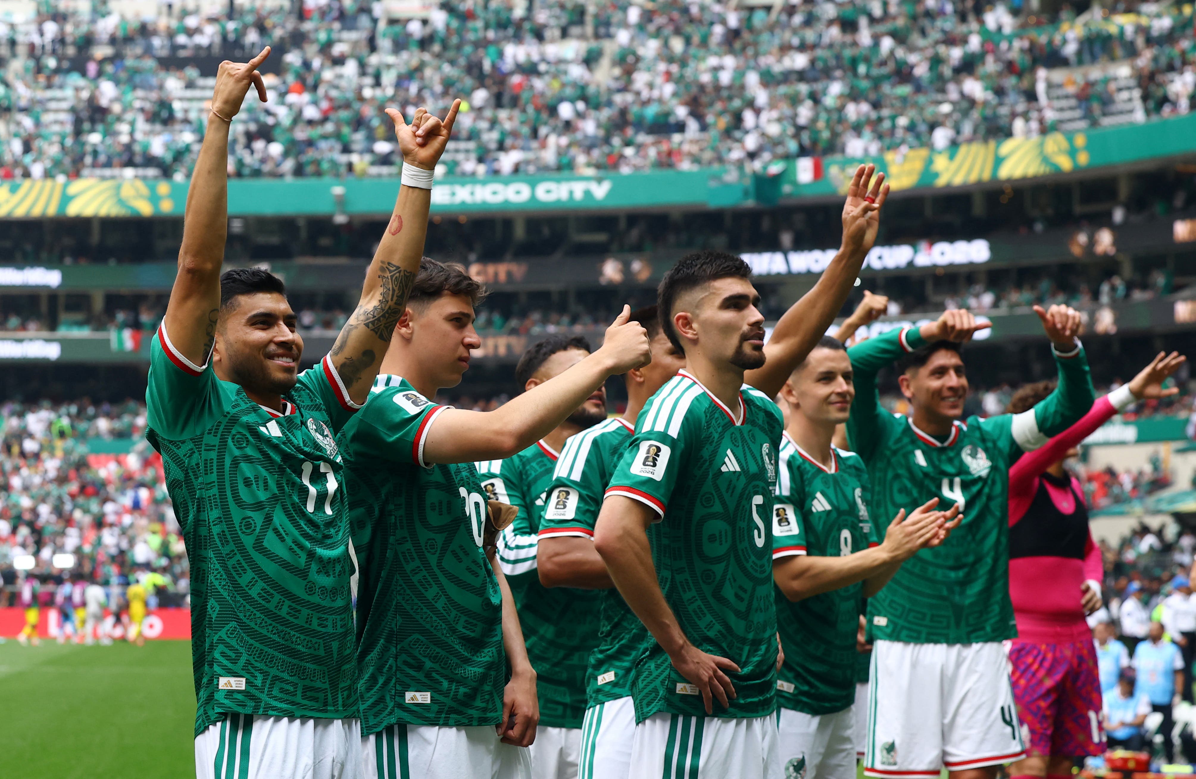 Soccer Football - FIFA World Cup 2026 - Group A - Mexico v South Africa - Estadio Azteca, Mexico City, Mexico - June 11, 2026 Mexico's Orbelin Pineda and teammates celebrate with fans after the match REUTERS/Pawel Kopczynski


