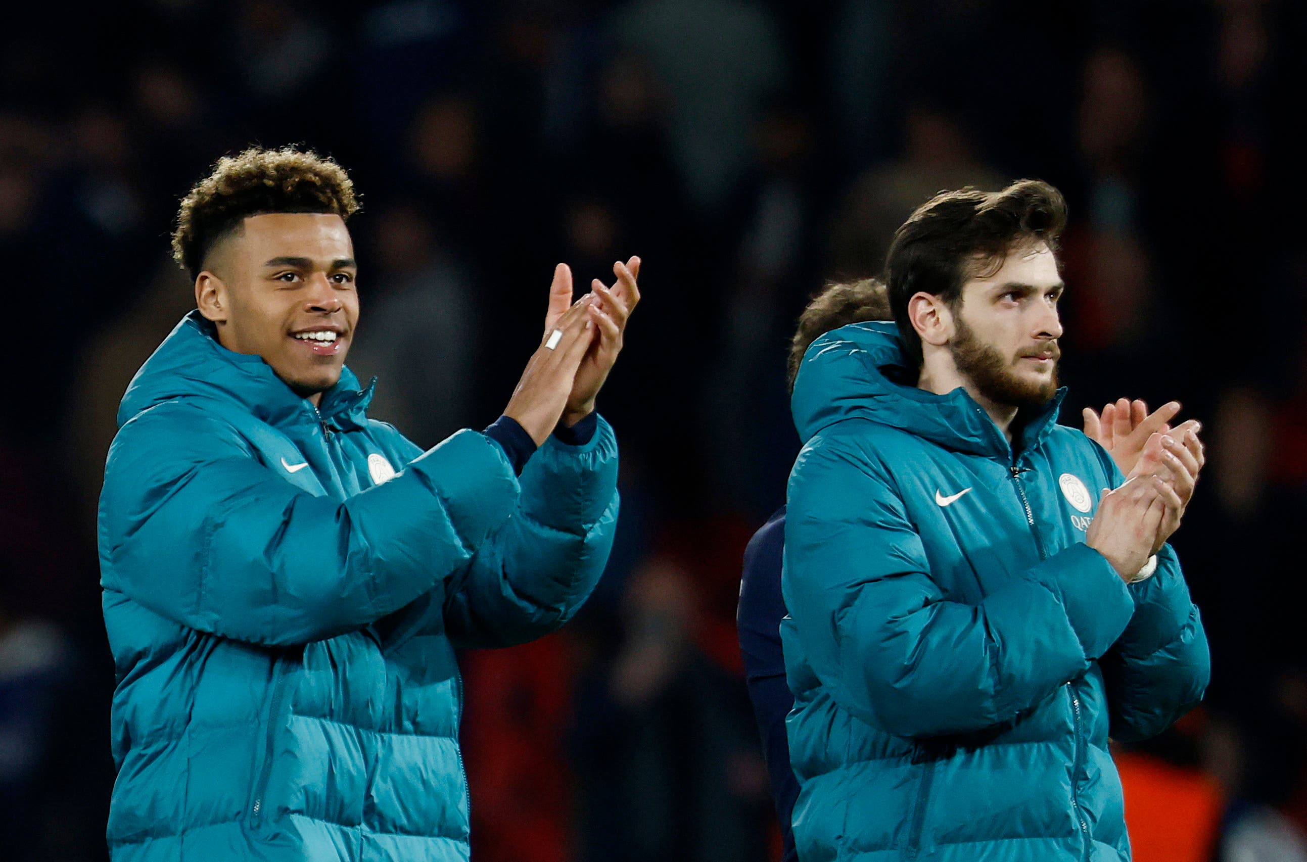 Paris St Germain's Khvicha Kvaratskhelia and Desire Doue celebrate after the match