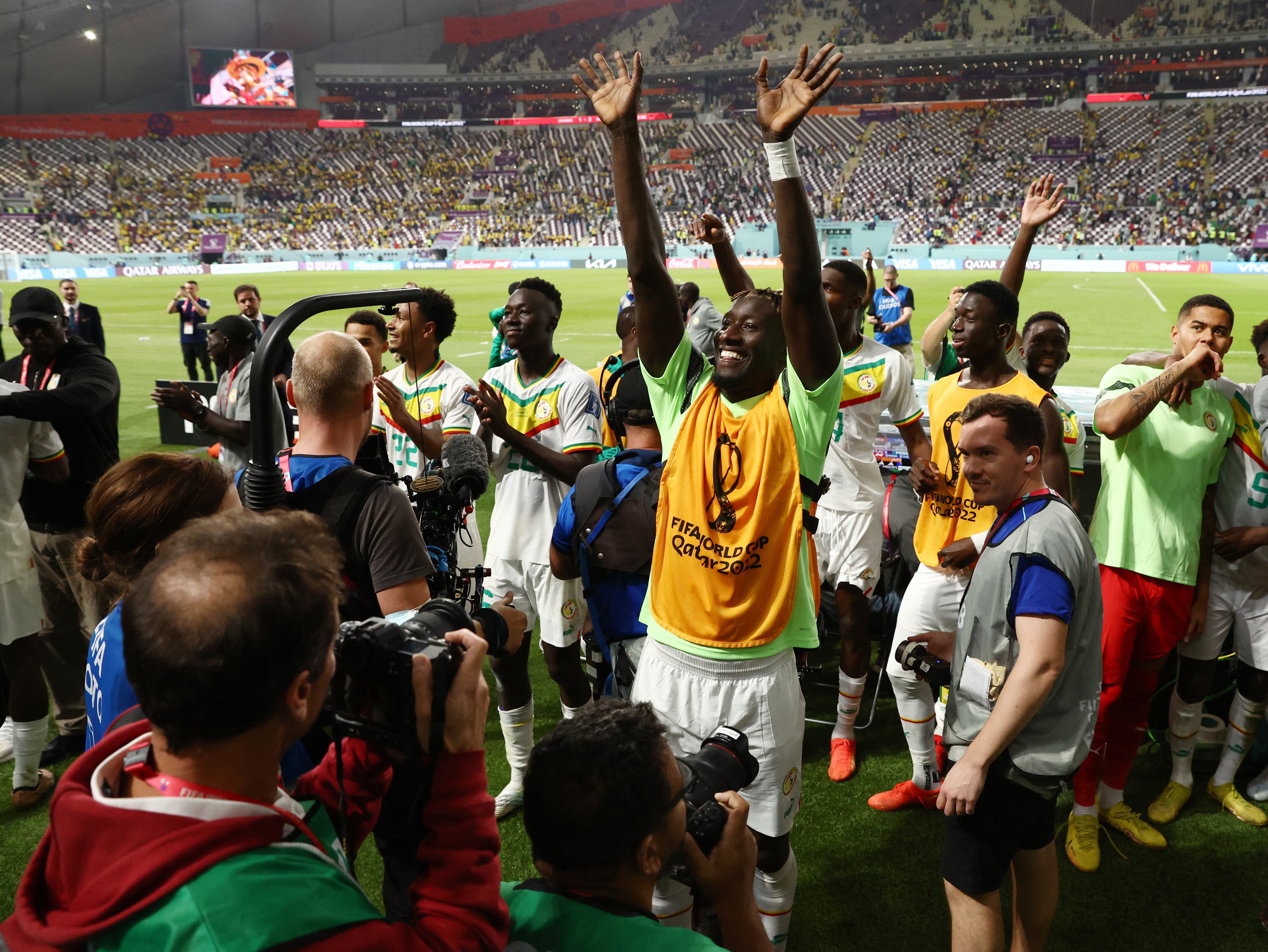 Soccer Football - FIFA World Cup Qatar 2022 - Group A - Ecuador v Senegal - Khalifa International Stadium, Doha, Qatar - November 29, 2022 Senegal players celebrate qualifying for the knockout stages REUTERS/Stephane Mahe