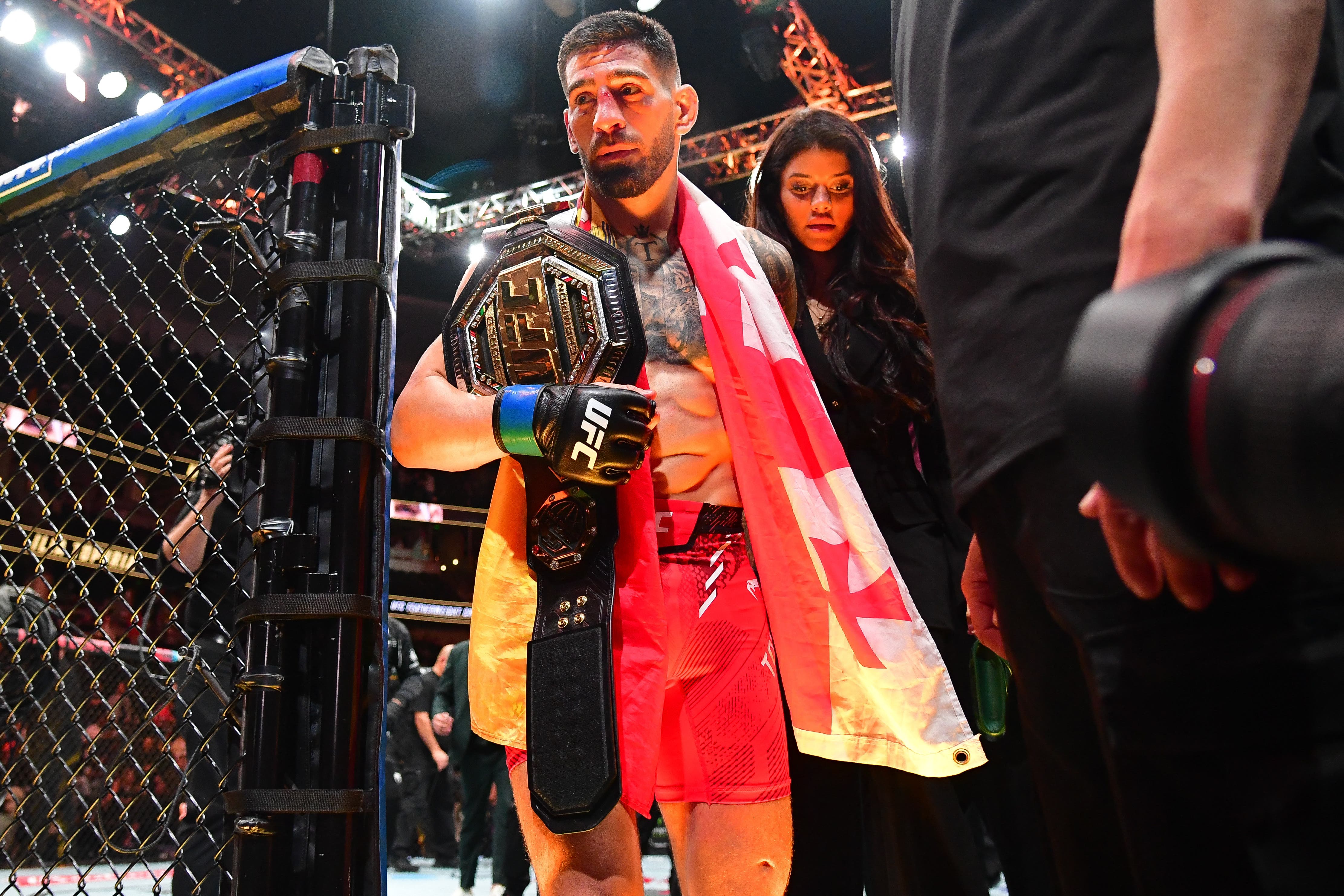  Ilia Topuria celebrates his championship victory against Alexander Volkanovski during UFC 298