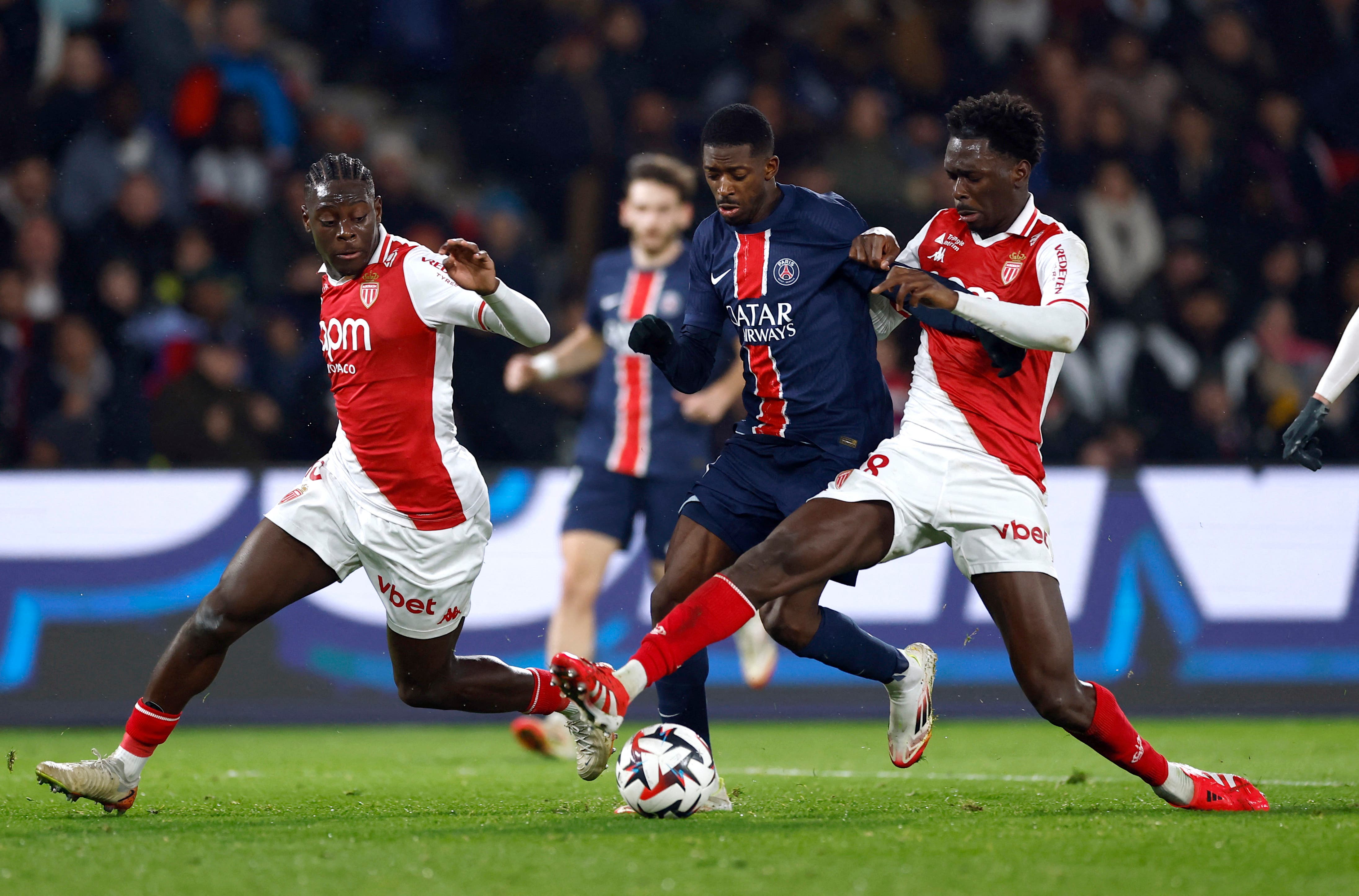 Soccer Football - Ligue 1 - Paris St Germain v AS Monaco - Parc des Princes, Paris, France - February 7, 2025 Paris St Germain's Ousmane Dembele in action with AS Monaco's Soungoutou Magassa REUTERS/Gonzalo Fuentes