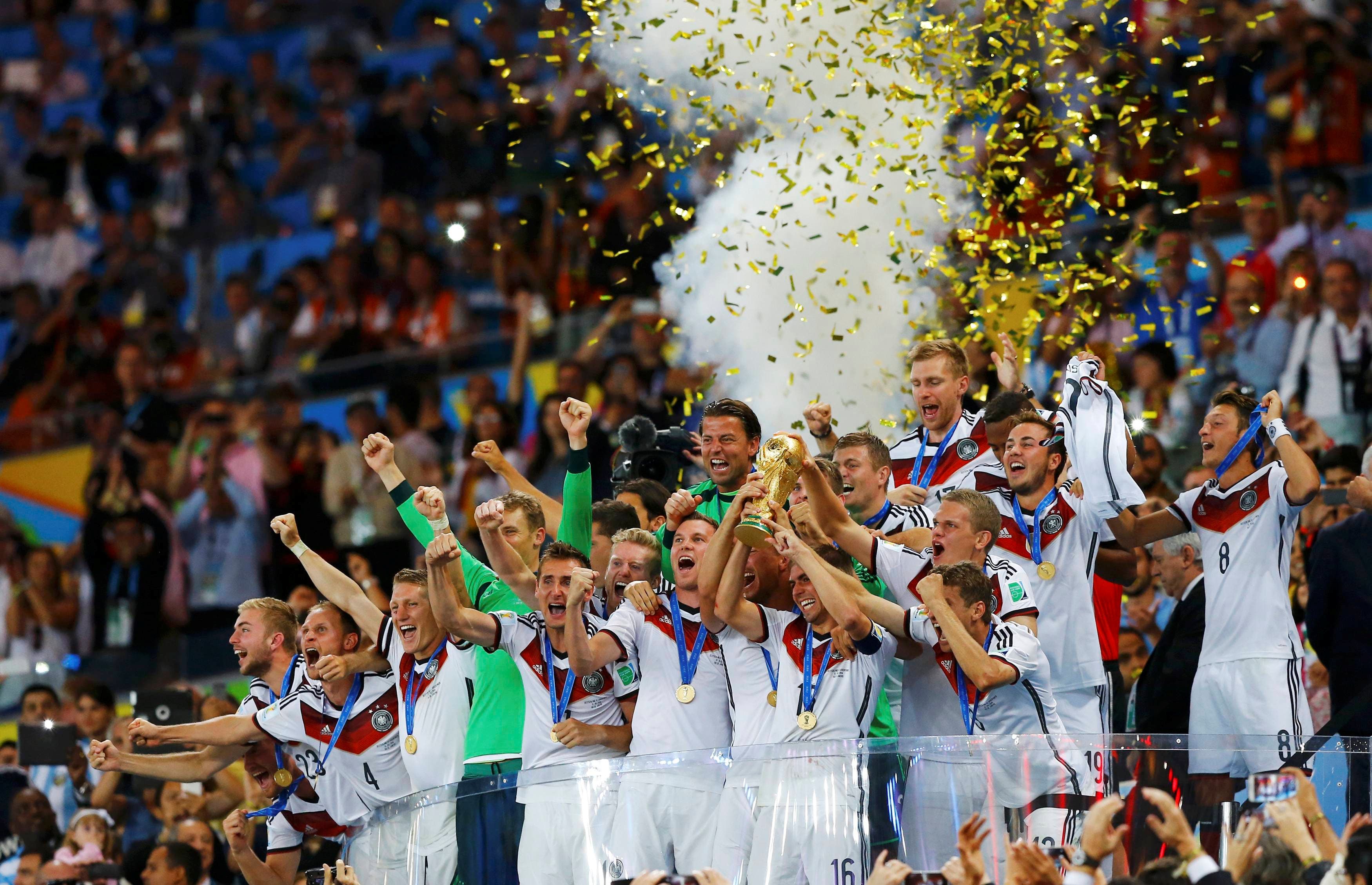 FILE PHOTO: Germany's players lift the World Cup trophy as they celebrate their 2014 World Cup final win against Argentina at the Maracana stadium in Rio de Janeiro July 13, 2014. REUTERS/Darren Staples/File Photo
